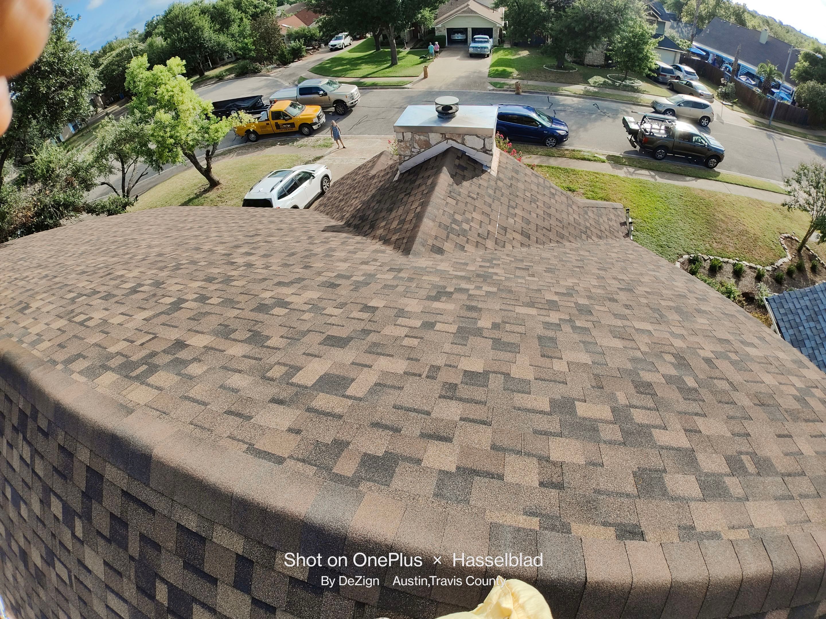New Roof Installation Of IKO Dynasty Color Brownstone by DeZign Roofing & Exteriors