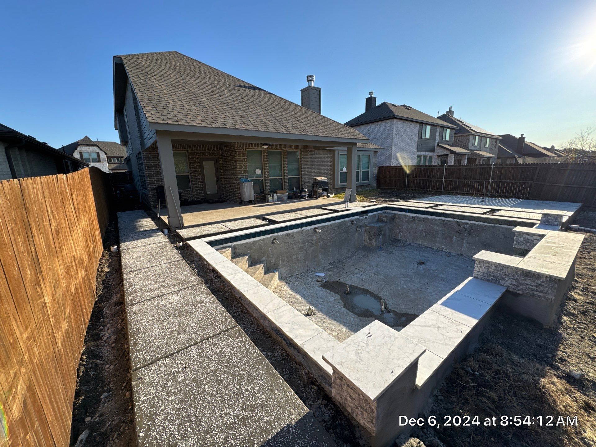 Geometric Pool with Raised Water Feature Wall and Turf by Pinnacle Pools and Spas - DFW