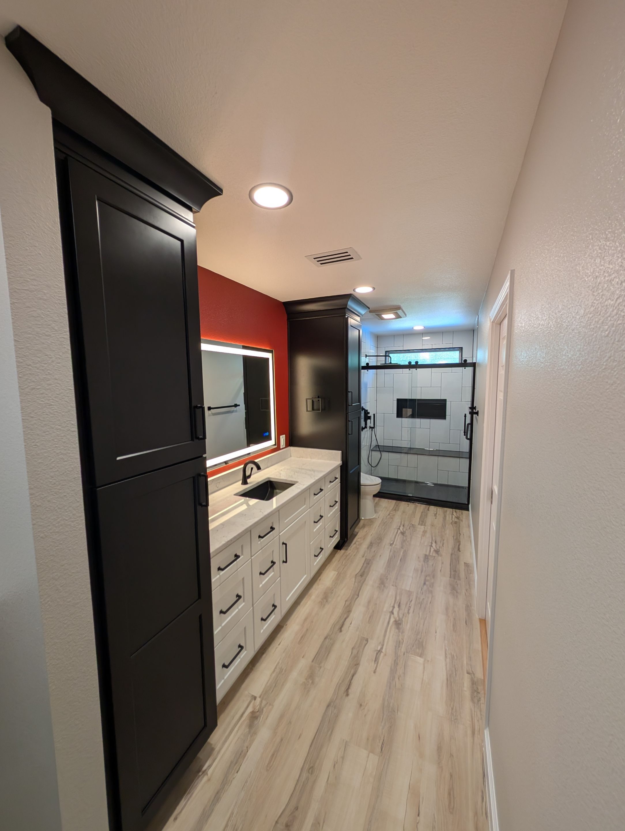 Universal City Tub-to-Shower Conversion with Built-In Bench and Backlit Mirror by Legacy Bath and Kitchen 