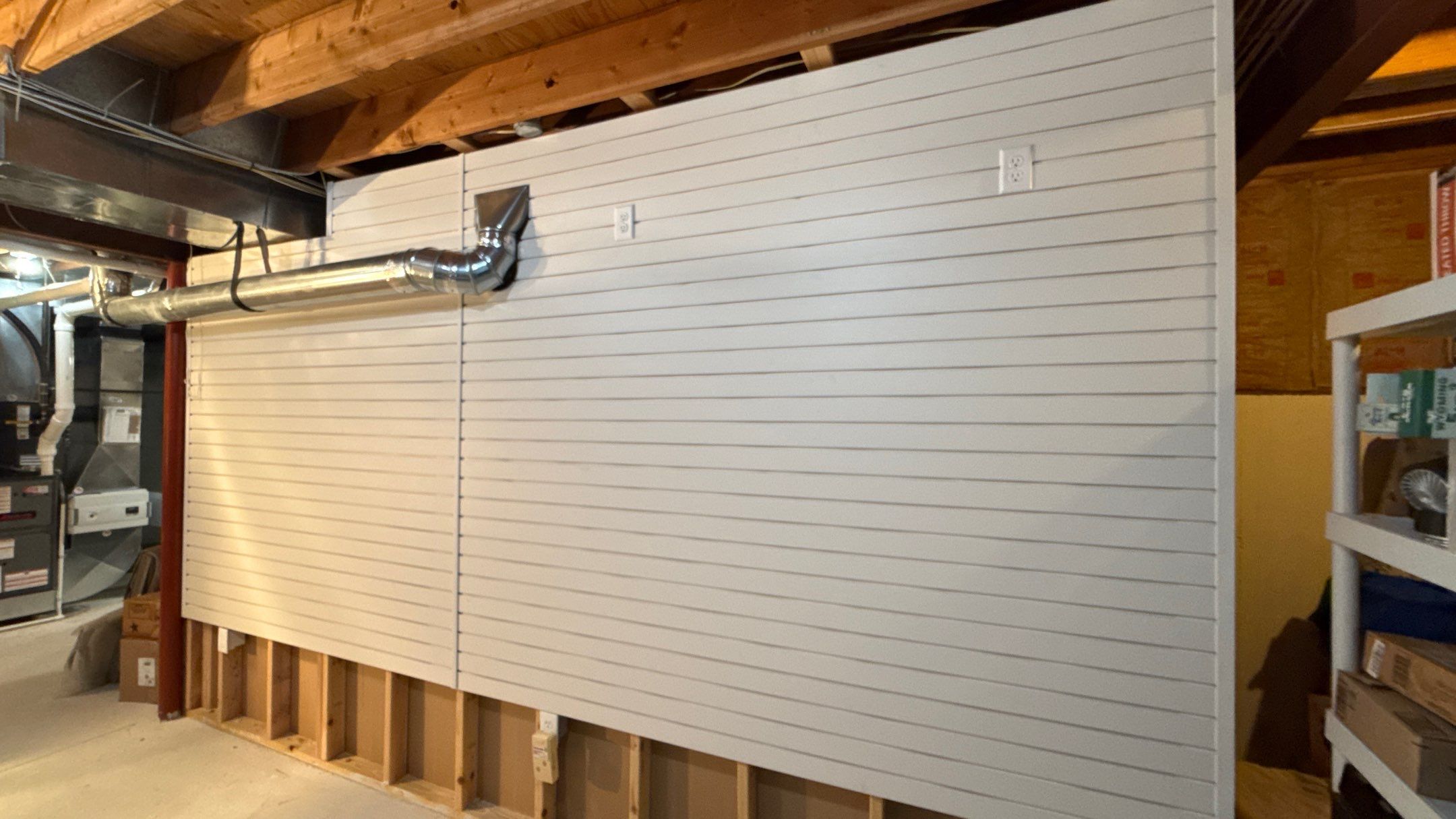 Garage Organization With Overhead Racks and Slatwall in Overland Park by Banner Garage