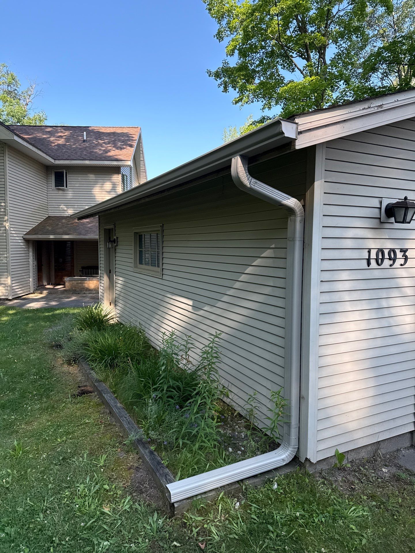 Residential Gutter System and Downspout Extension Installation in Traverse City by Rainbow Seamless Systems