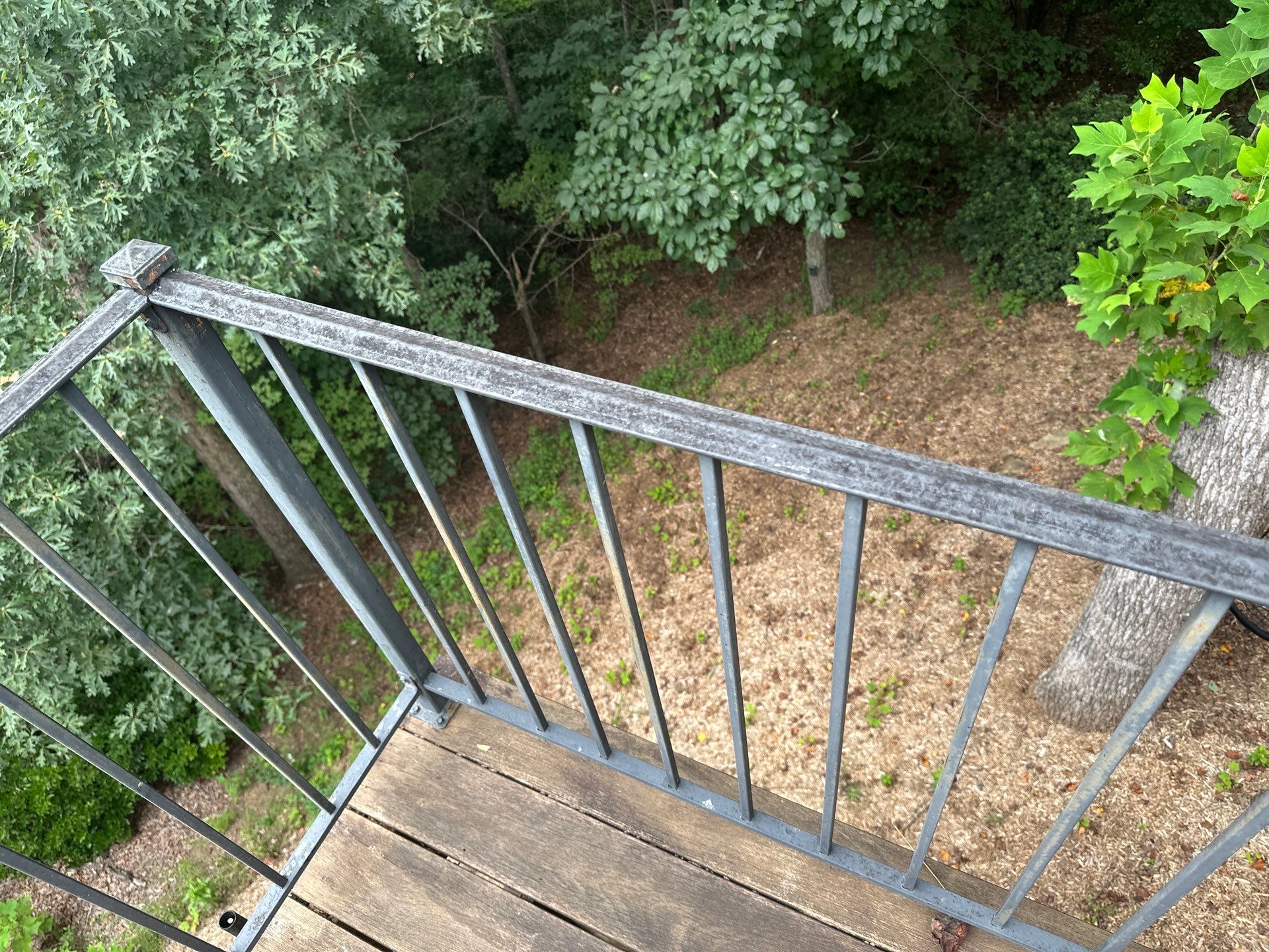 Wood Deck Refinishing and Black Metal Railing Upgrade in Travelers Rest by Painter1