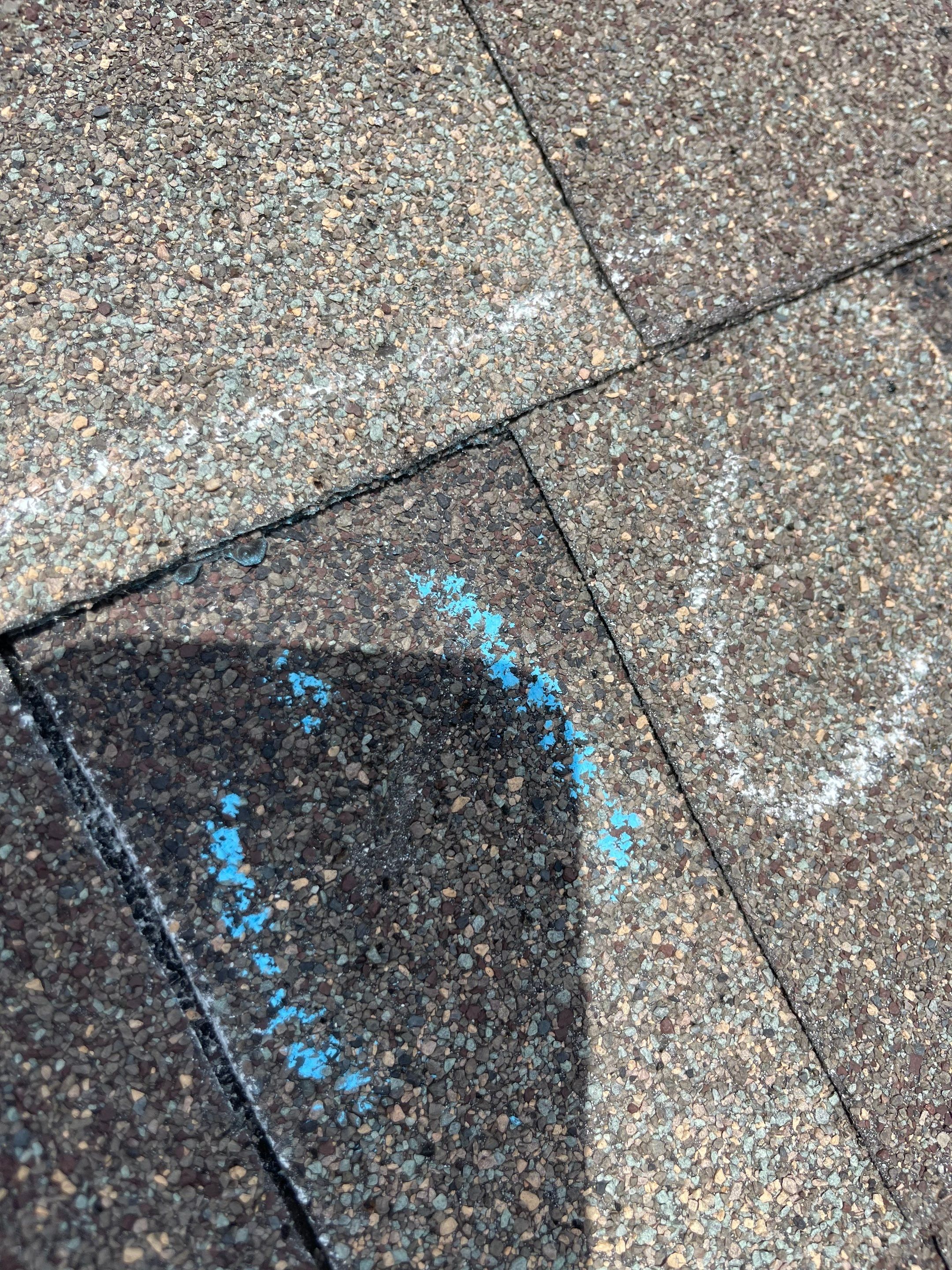 Hail Damage on a Roofing System by Icon Roofing And Construction 