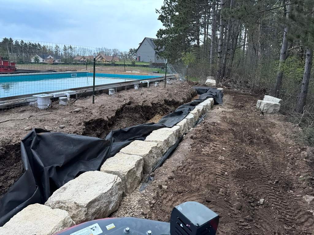 Limestone Boulder Wall by Sota landscaping