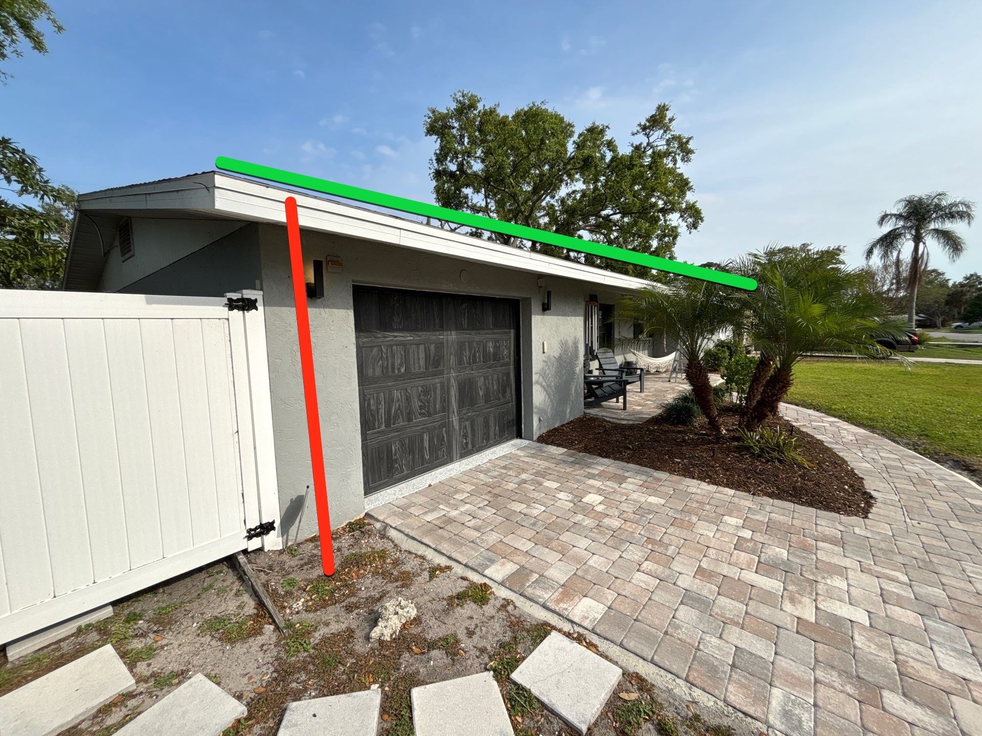 Black Seamless Gutters using 7 inch seamless gutters & New White Soffit in Sarasota FL by Gutter Professors