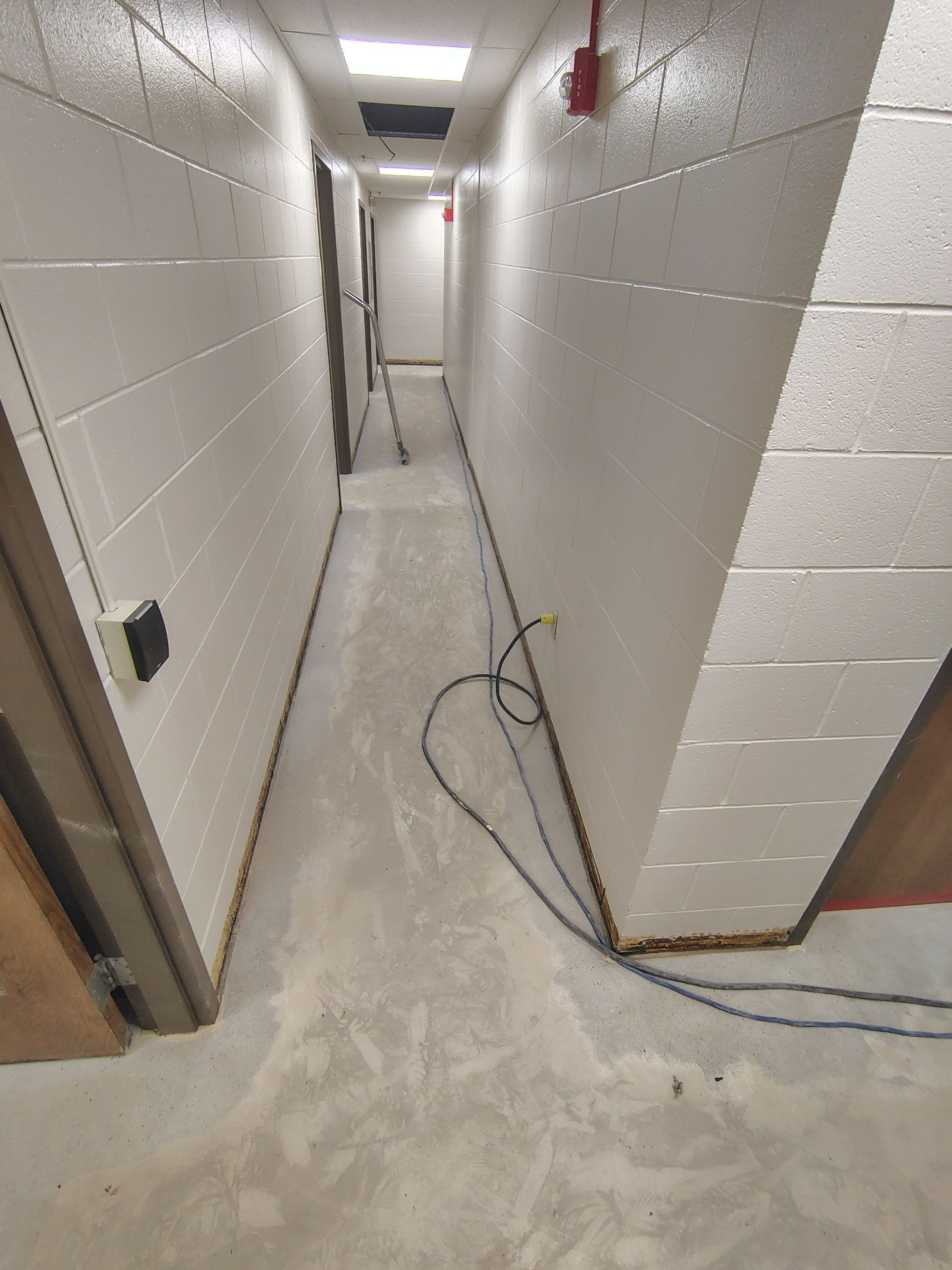 Industrial Flake Epoxy Floor Installation at Pierre National Guard Facility by Select Painting, Coatings & Garage Cabinets