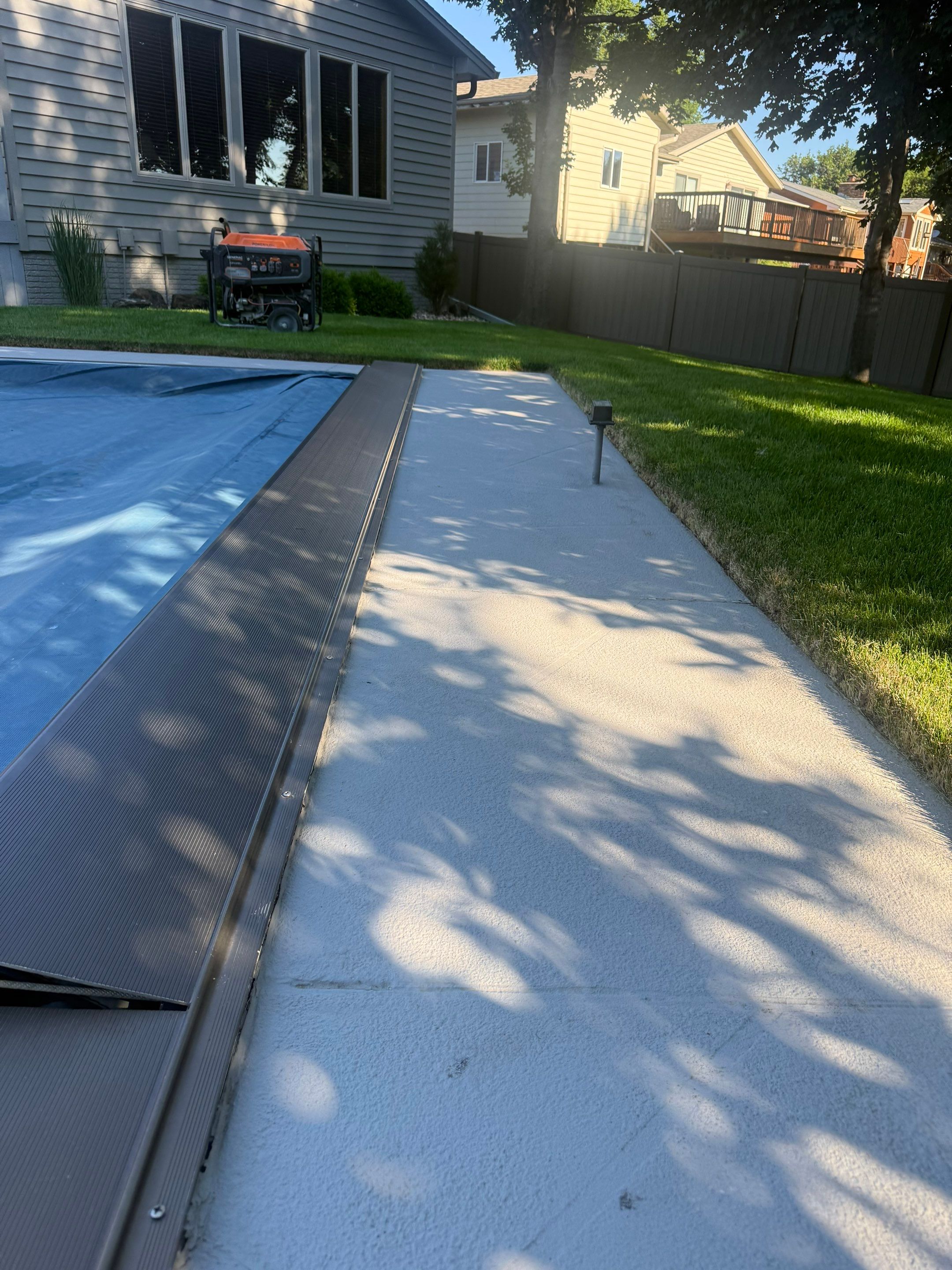 Residential Pool Deck Resurfacing in Sioux Falls by Select Painting, Coatings & Garage Cabinets