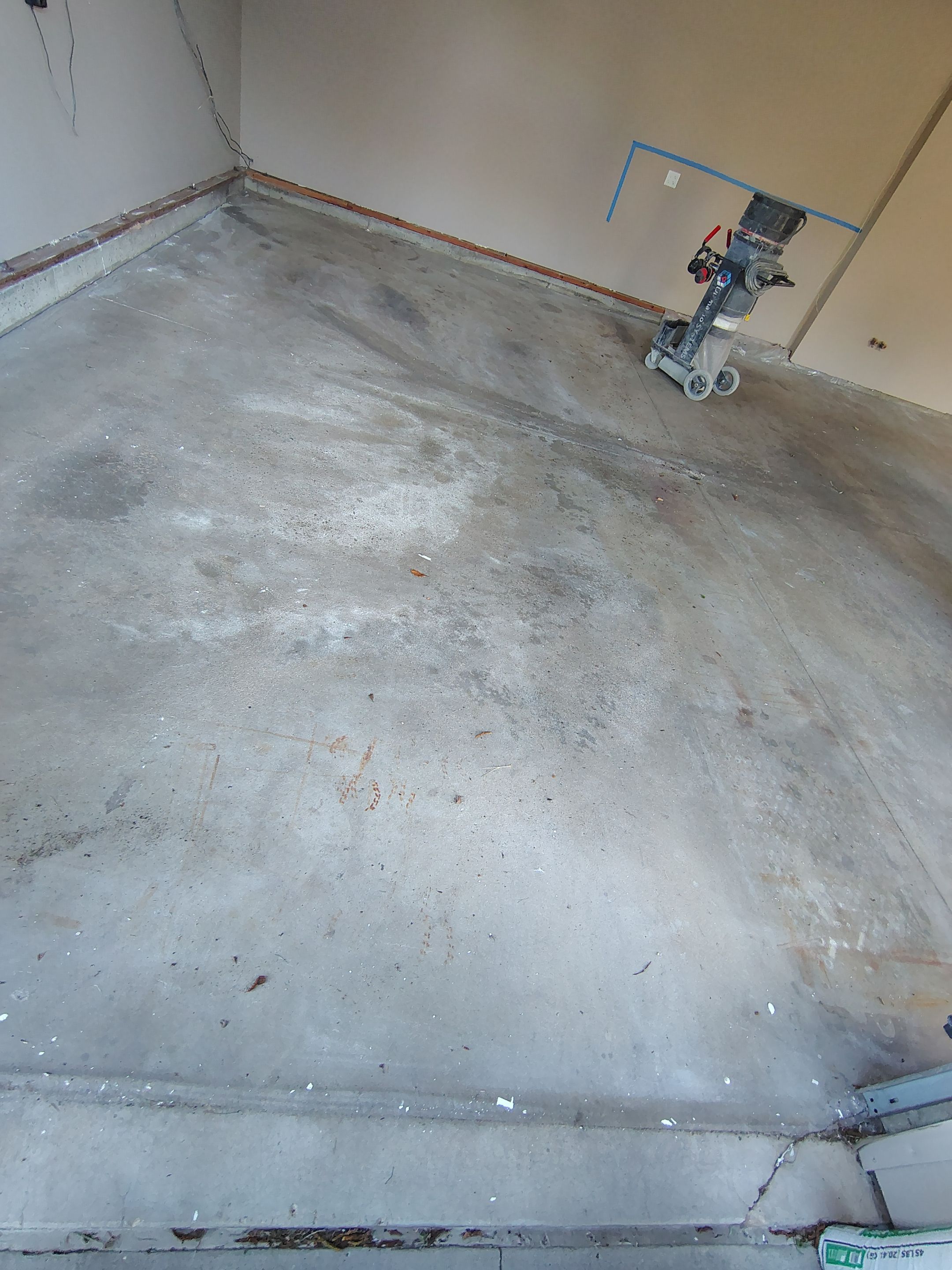 Sioux Falls Garage Concrete Repair and Epoxy Flake Floor Coating by Select Painting, Coatings & Garage Cabinets