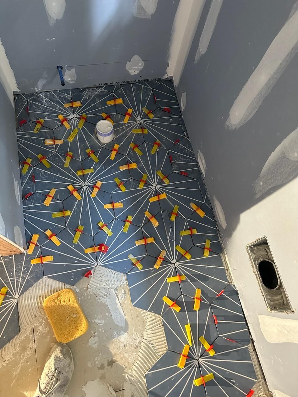 Jack & Jill Bathroom Floor + Dog Washing Nook with Niche using Porceline Subway Tile by Footprints Floors Morristown