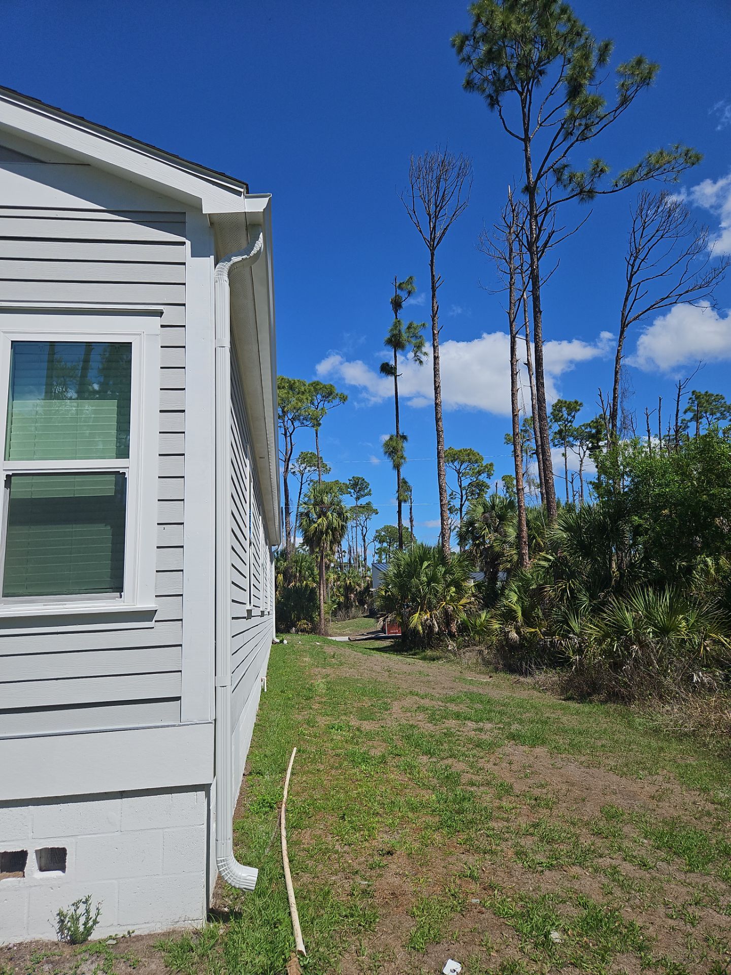Downspout Installation using 3X4 Elbow Downspout in Port Charlotte FL by Gutter Professors