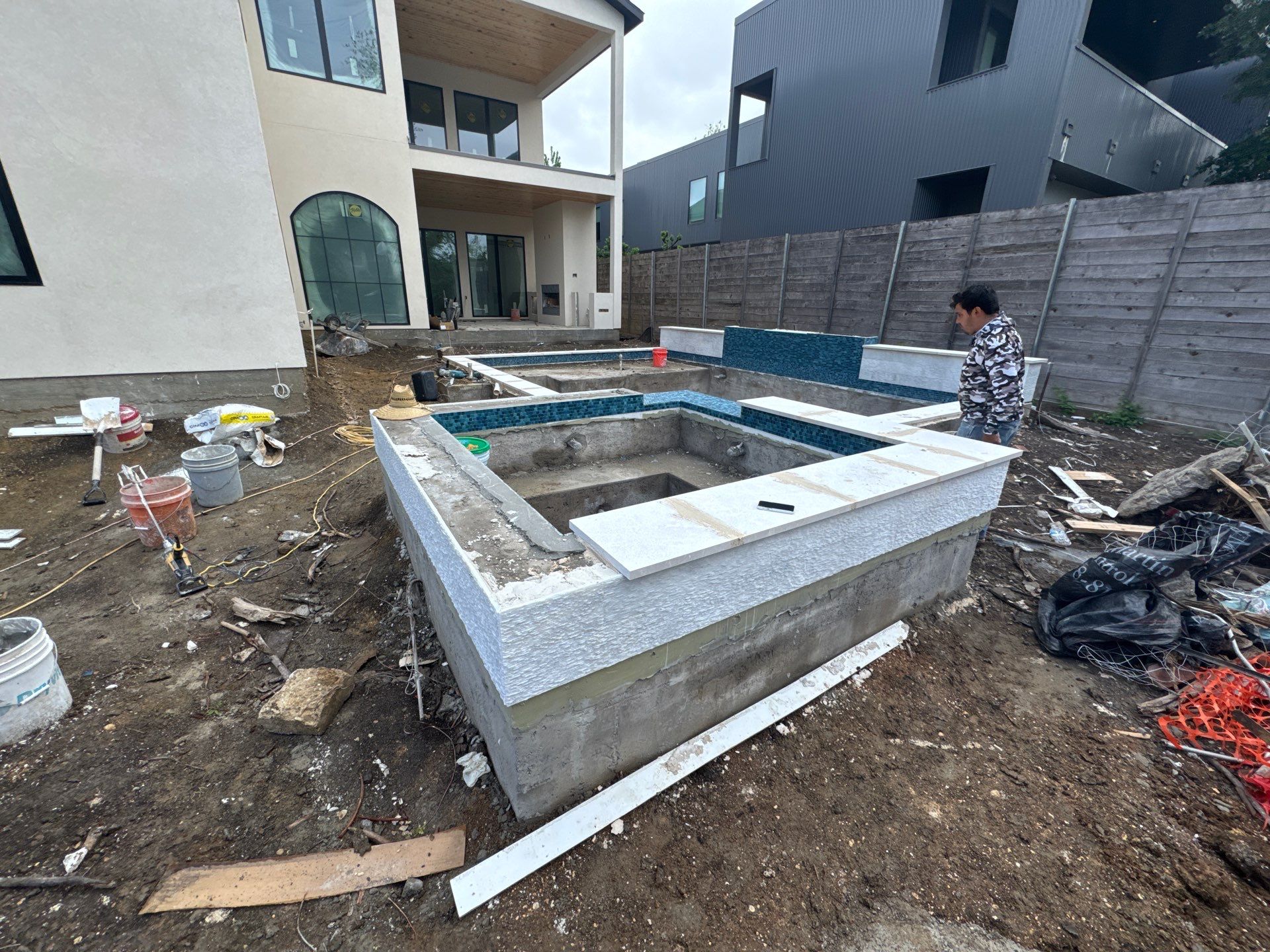 Modern Pool with Raised Glass-Tile Spa by Pinnacle Pools and Spas - DFW