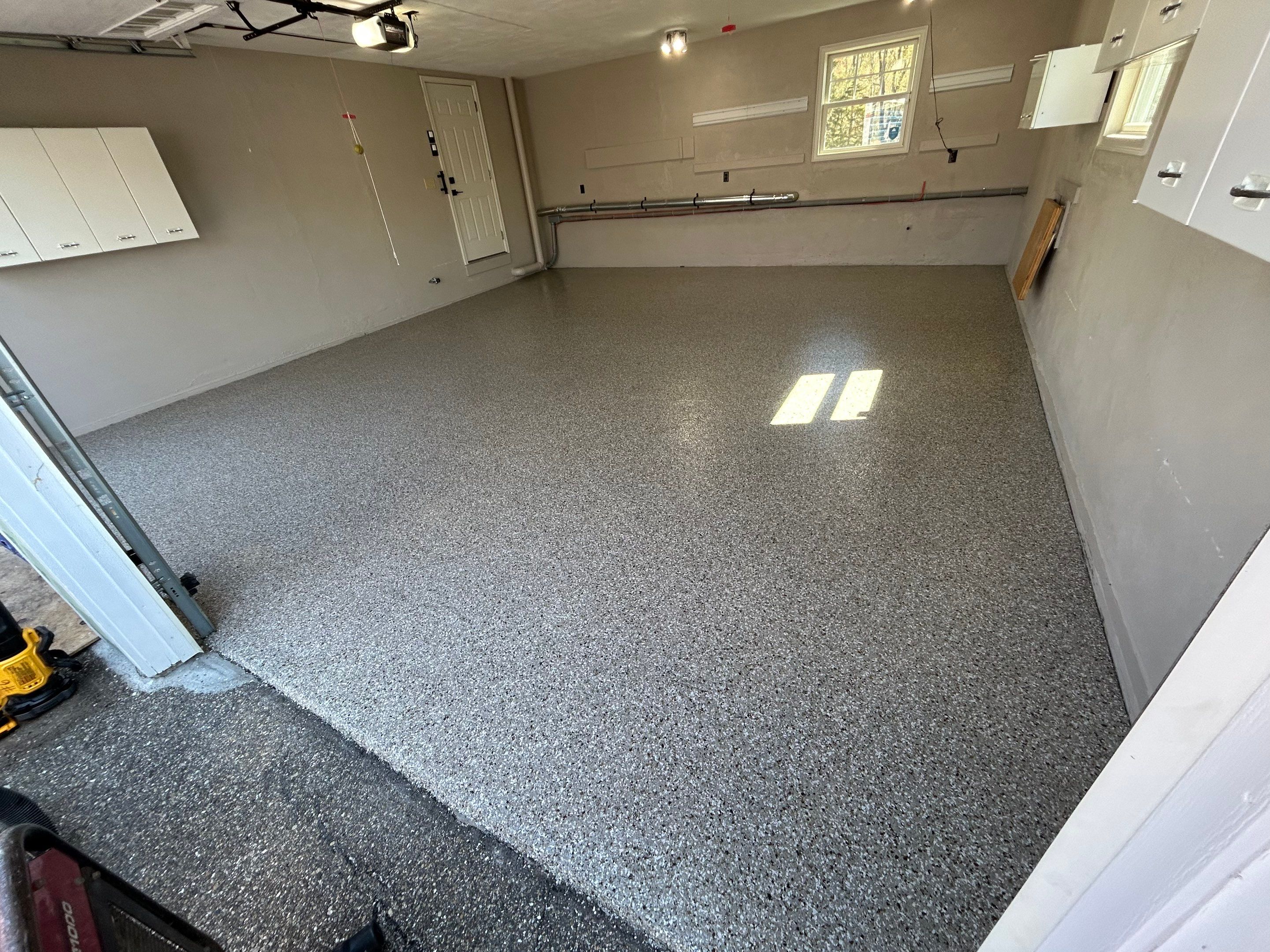Garage Floor Transformation with Durable Concrete Floor Coating by DiGiorgi Roofing and Siding Inc
