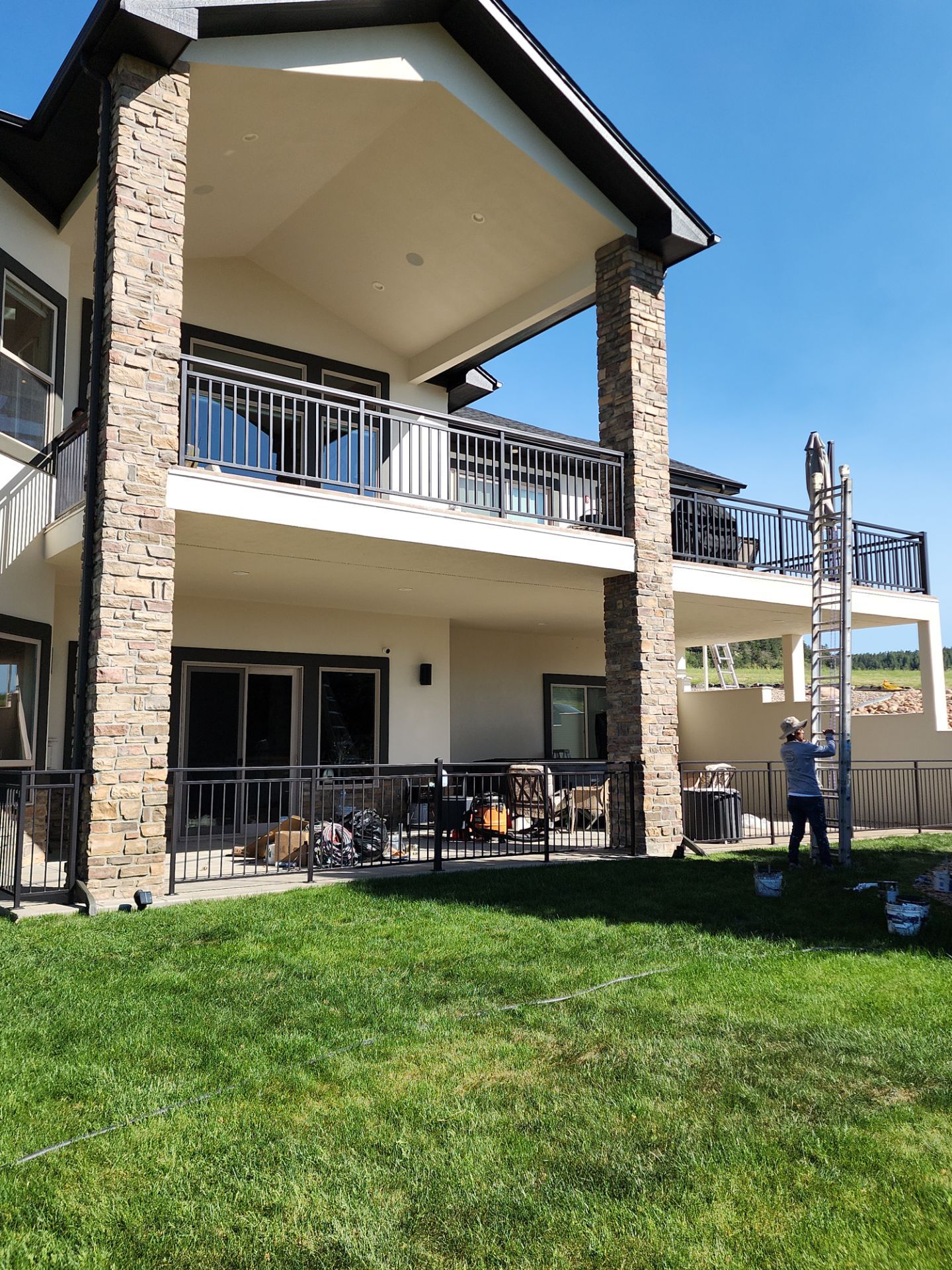 Castle Rock Elegance: White Stucco Exterior with Bold Tricorn Black by J&M Painting LLC