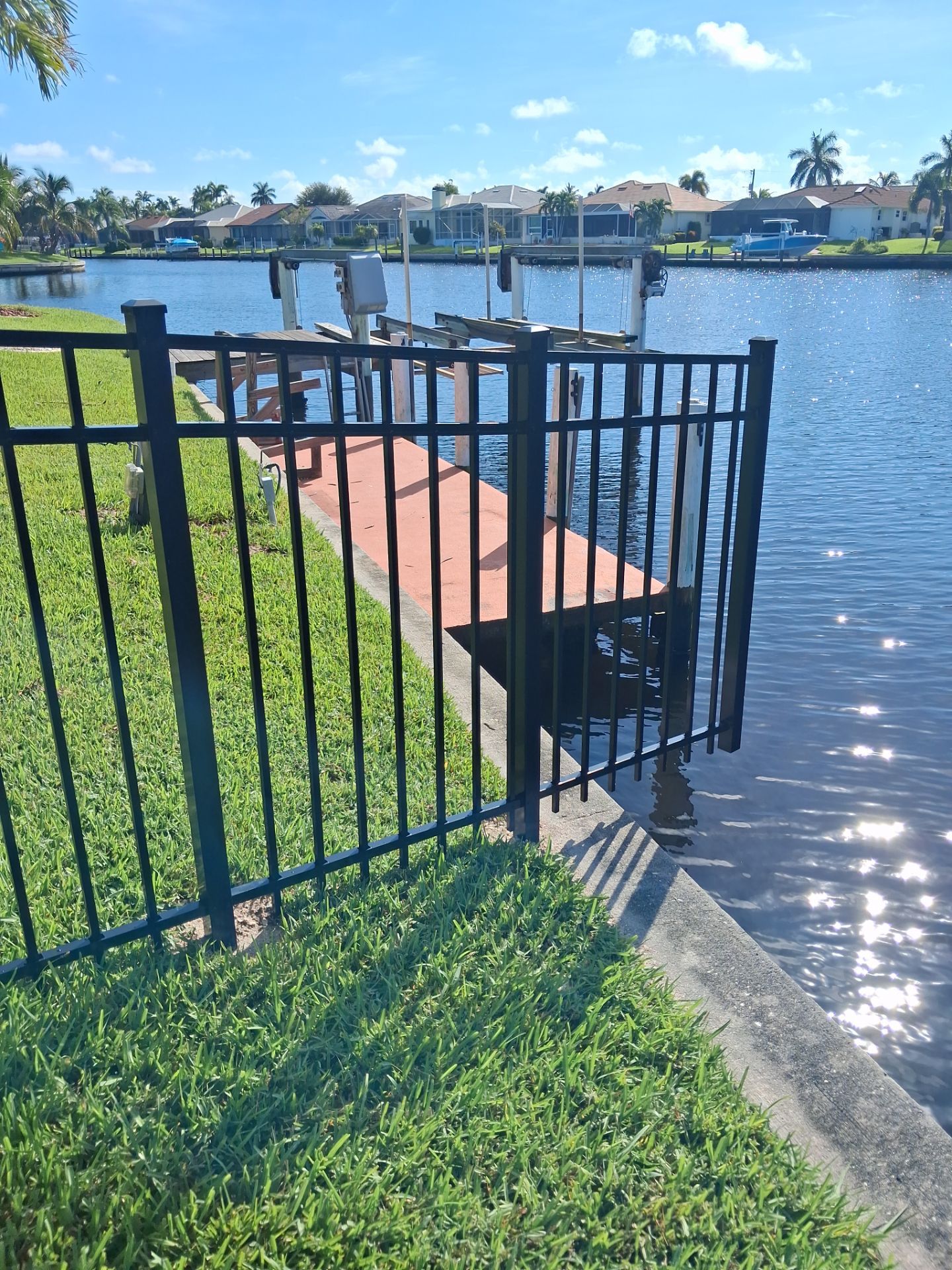 Custom Black Aluminum Fence Enclosure for Punta Gorda Waterfront Property by True Fence LLC