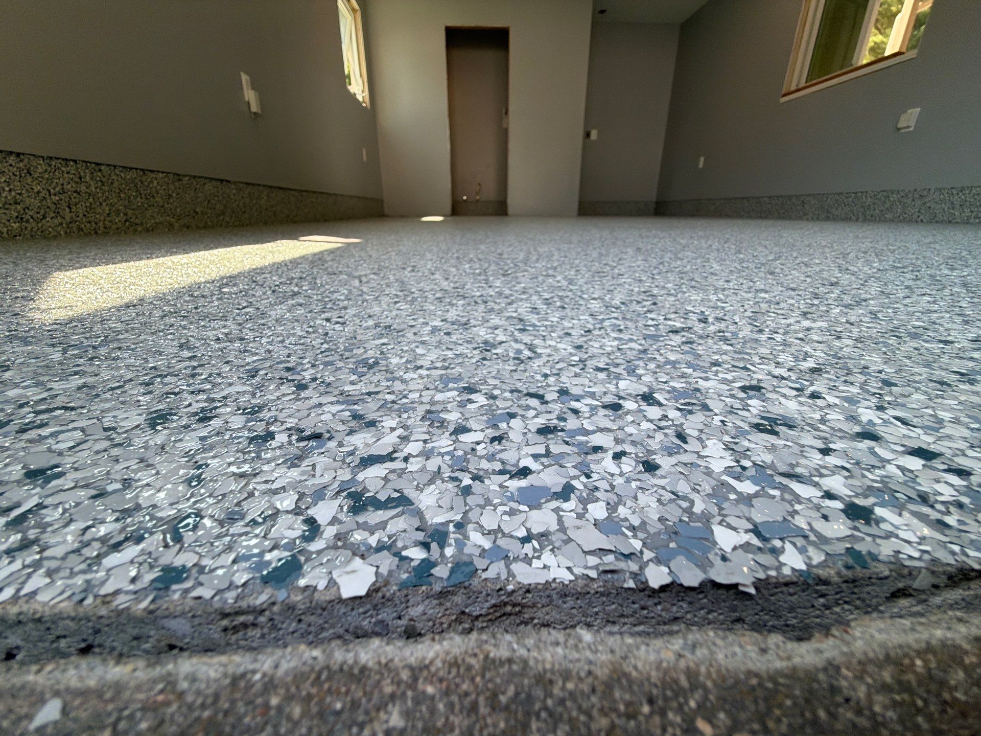 Custom Tidal Wave Epoxy Flake Floor Installation in Mears by Gordon Painting