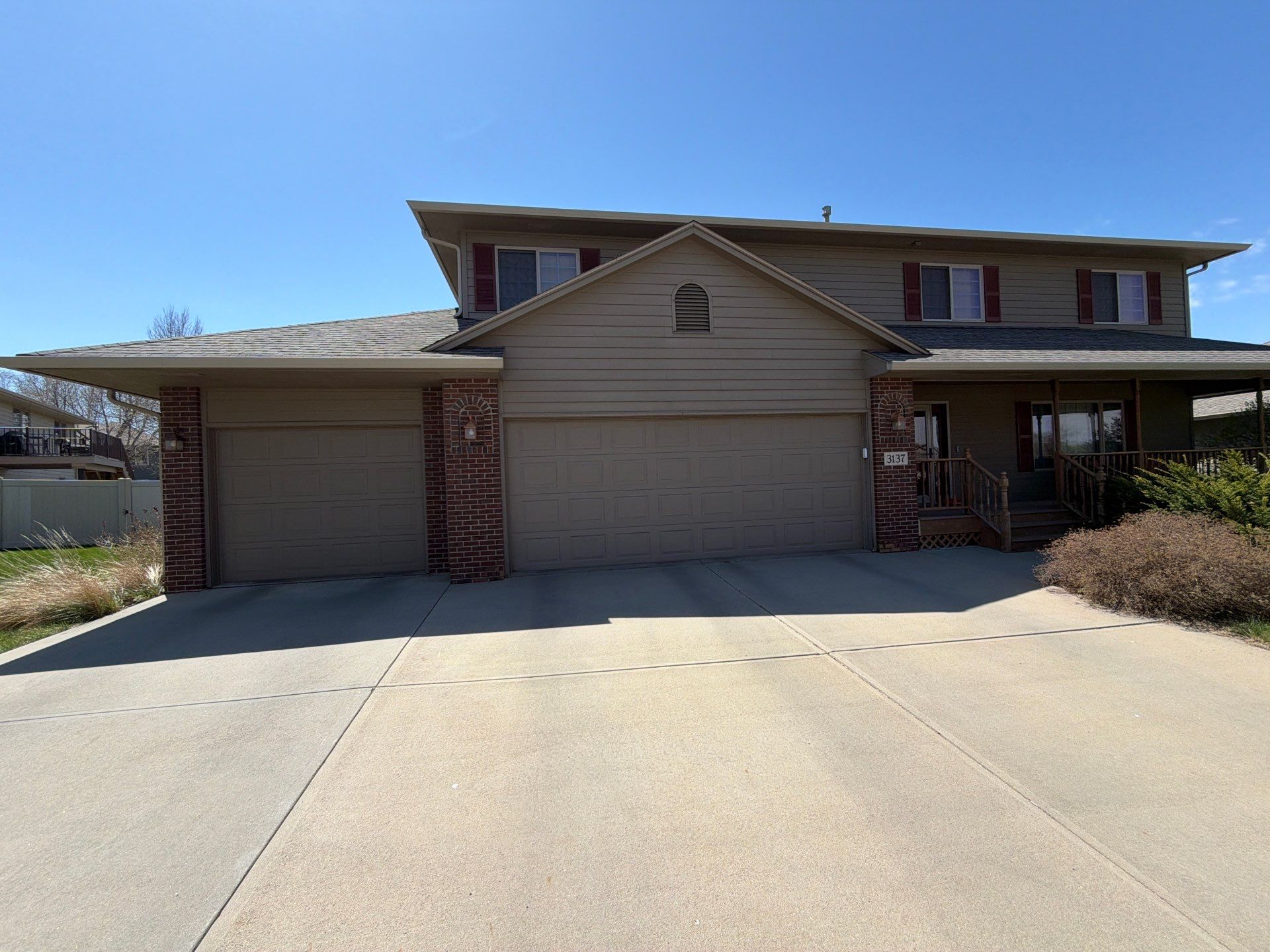 Residential Exterior Painting with Shutter and Trim Updates in Sioux Falls by Select Painting, Coatings & Garage Cabinets