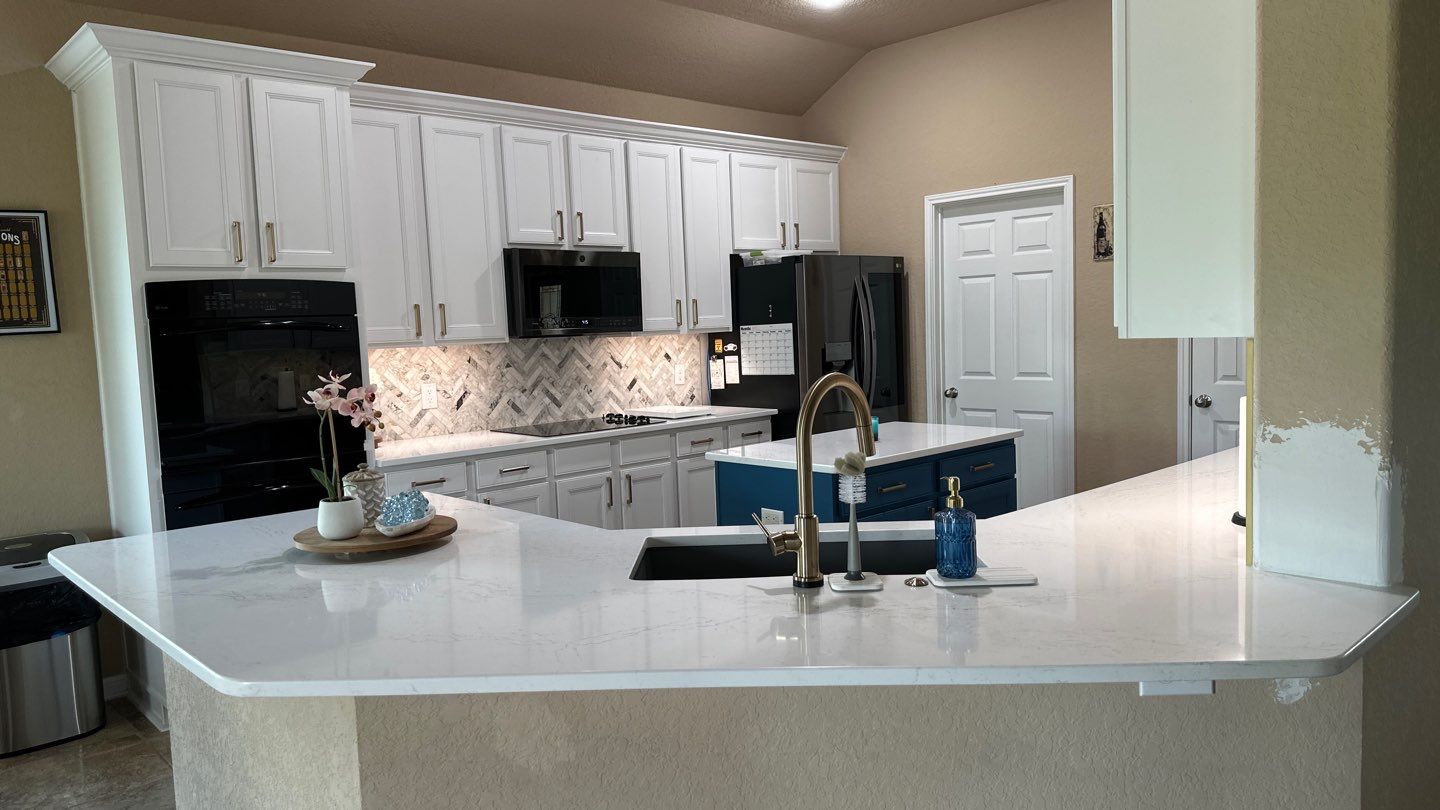 Cibolo Kitchen Refresh with Painted Cabinets, Quartz Countertops & Herringbone Backsplash by Legacy Bath and Kitchen 