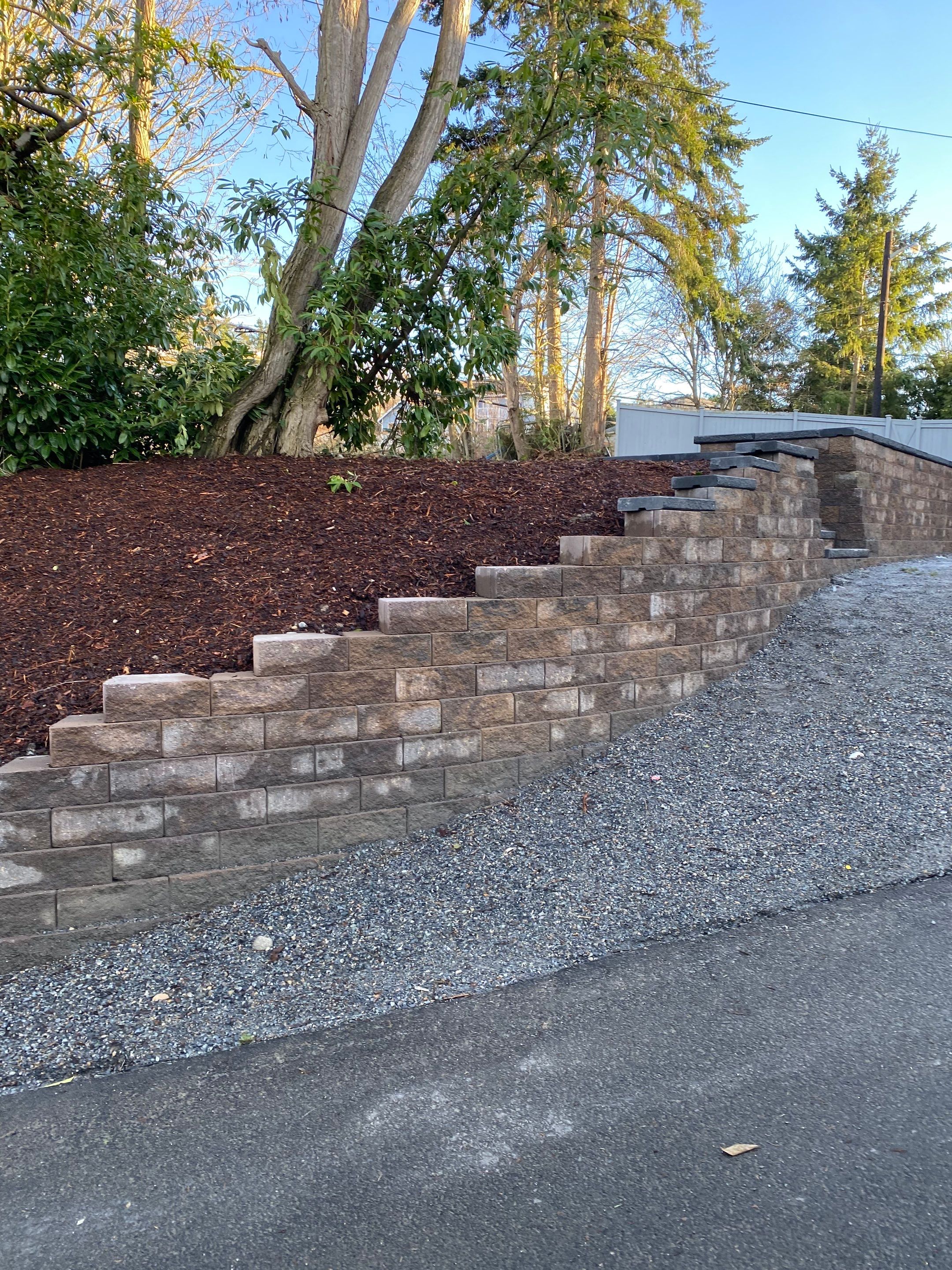 Patio Installation using Concrete, Retaining walls, and Turf install by Jireh Asphalt & Concrete Inc 