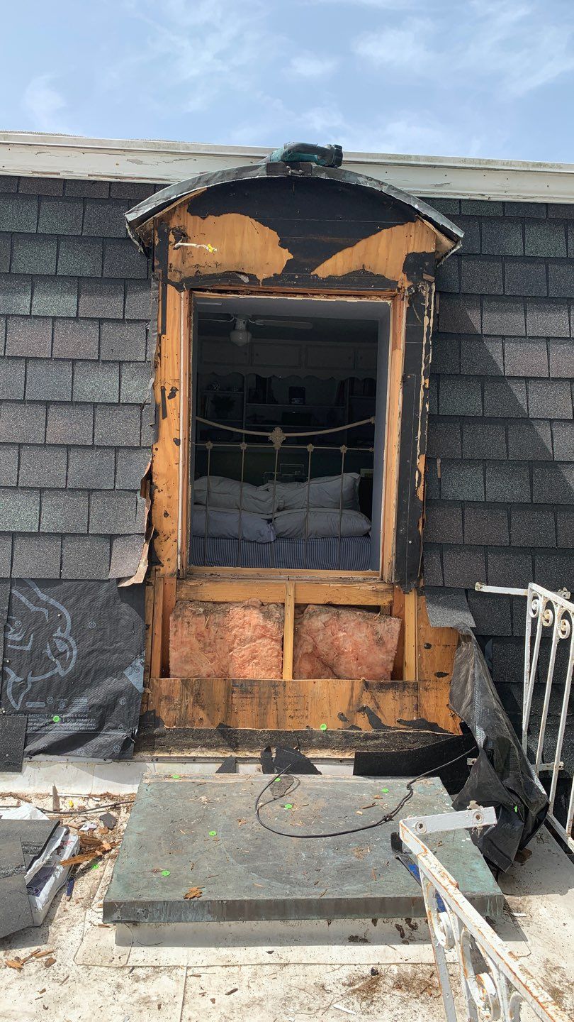 Mansard Charm by Bayfront Roofing and Construction