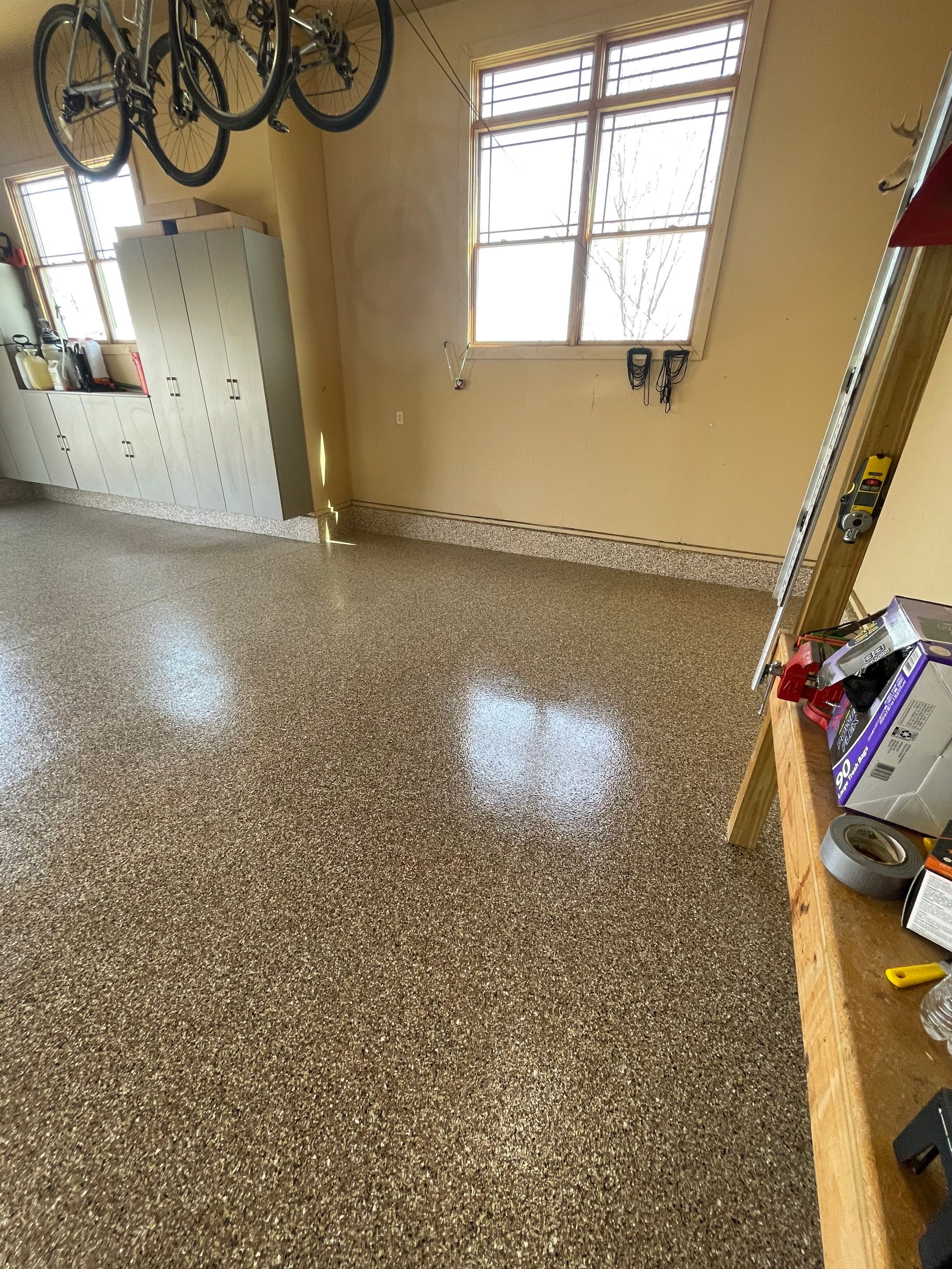 Residential Garage Floor Transformation with Speckled Epoxy Coating by Select Painting, Coatings & Garage Cabinets