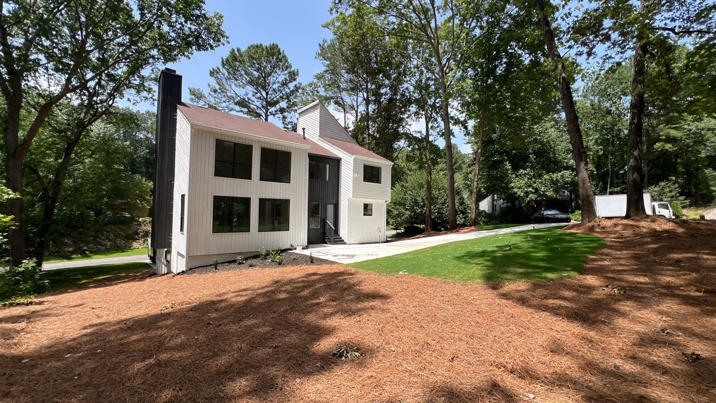 Modern Marietta Home Transformation with Custom Kitchen and Vertical Siding by Swift Home Renovations