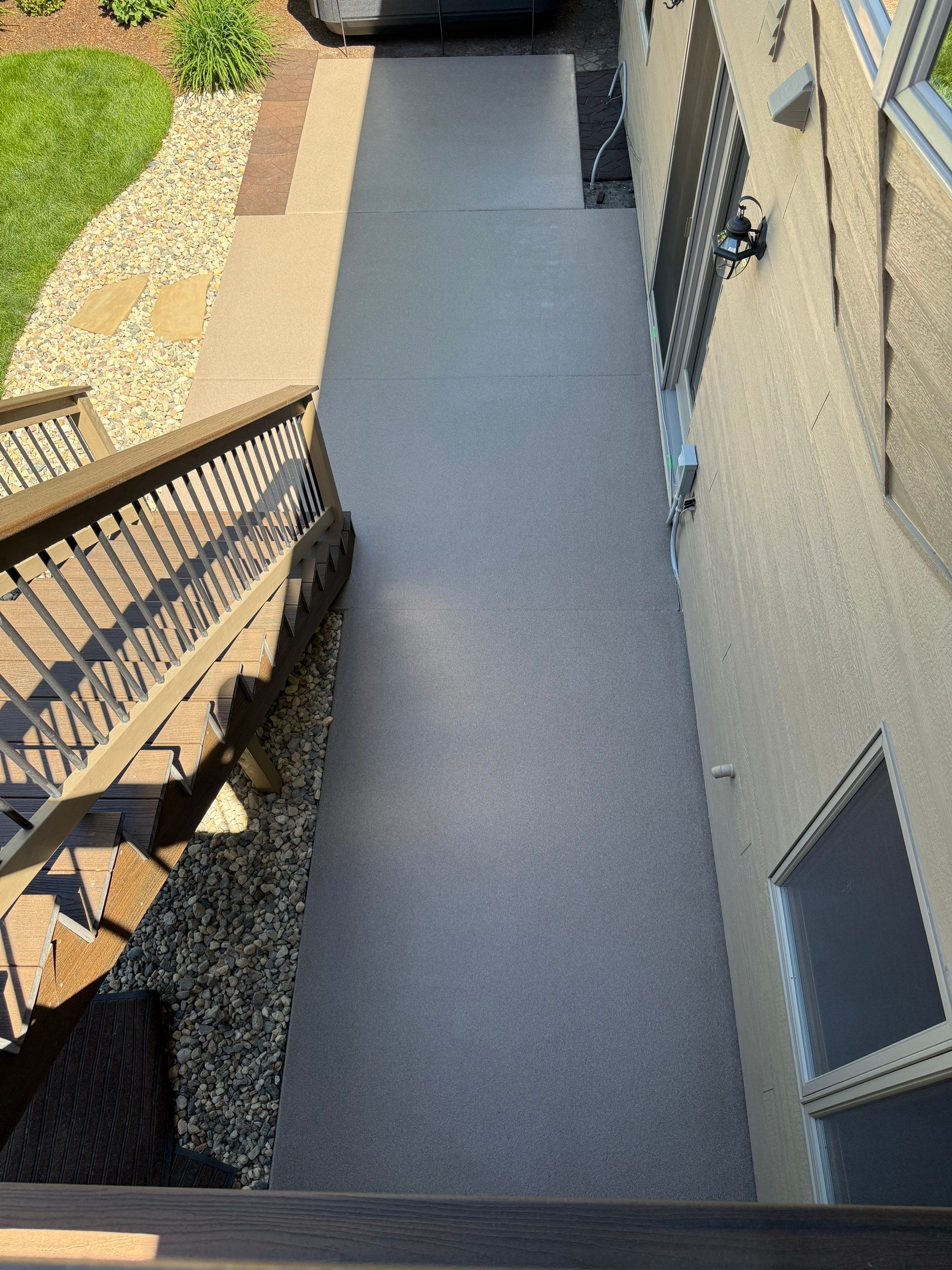 Textured Concrete Coating and Paver Patio Refresh in Sioux Falls by Select Painting, Coatings & Garage Cabinets