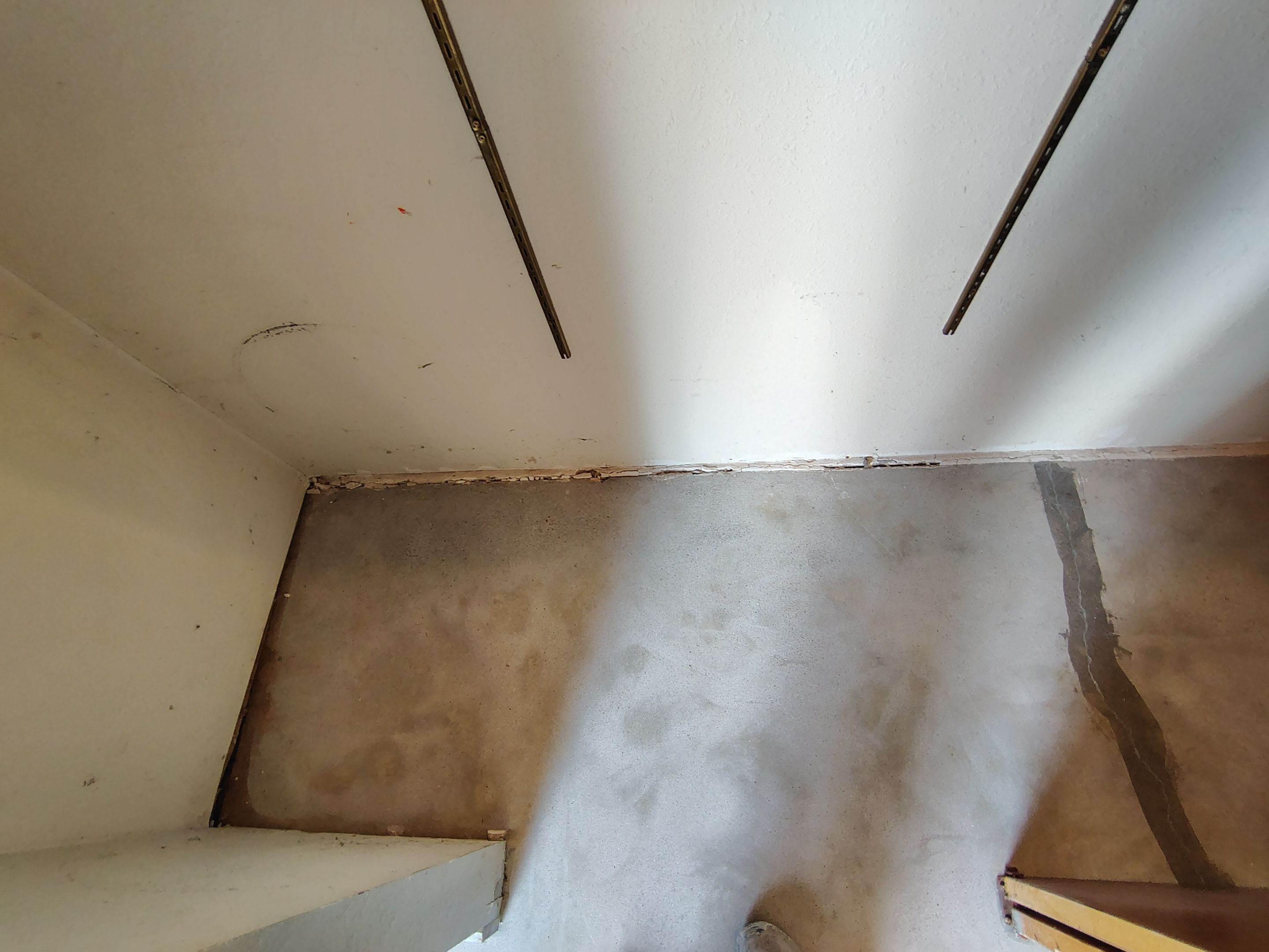 Domino Flake Garage Floor Coating Installation in Sioux Falls by Select Painting, Coatings & Garage Cabinets