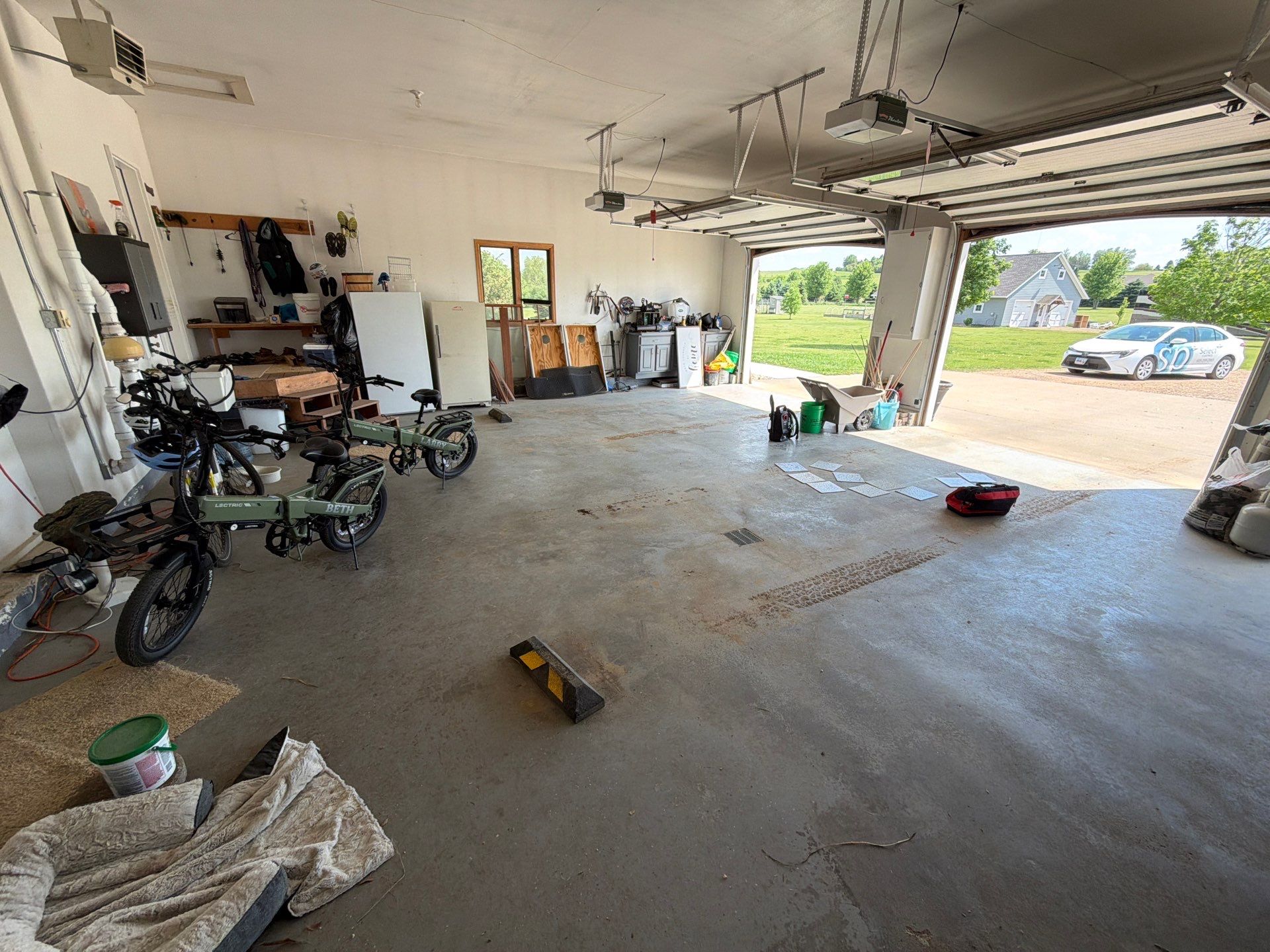 Feather Grey Garage Floor Coating Installation in Valley Springs by Select Painting, Coatings & Garage Cabinets