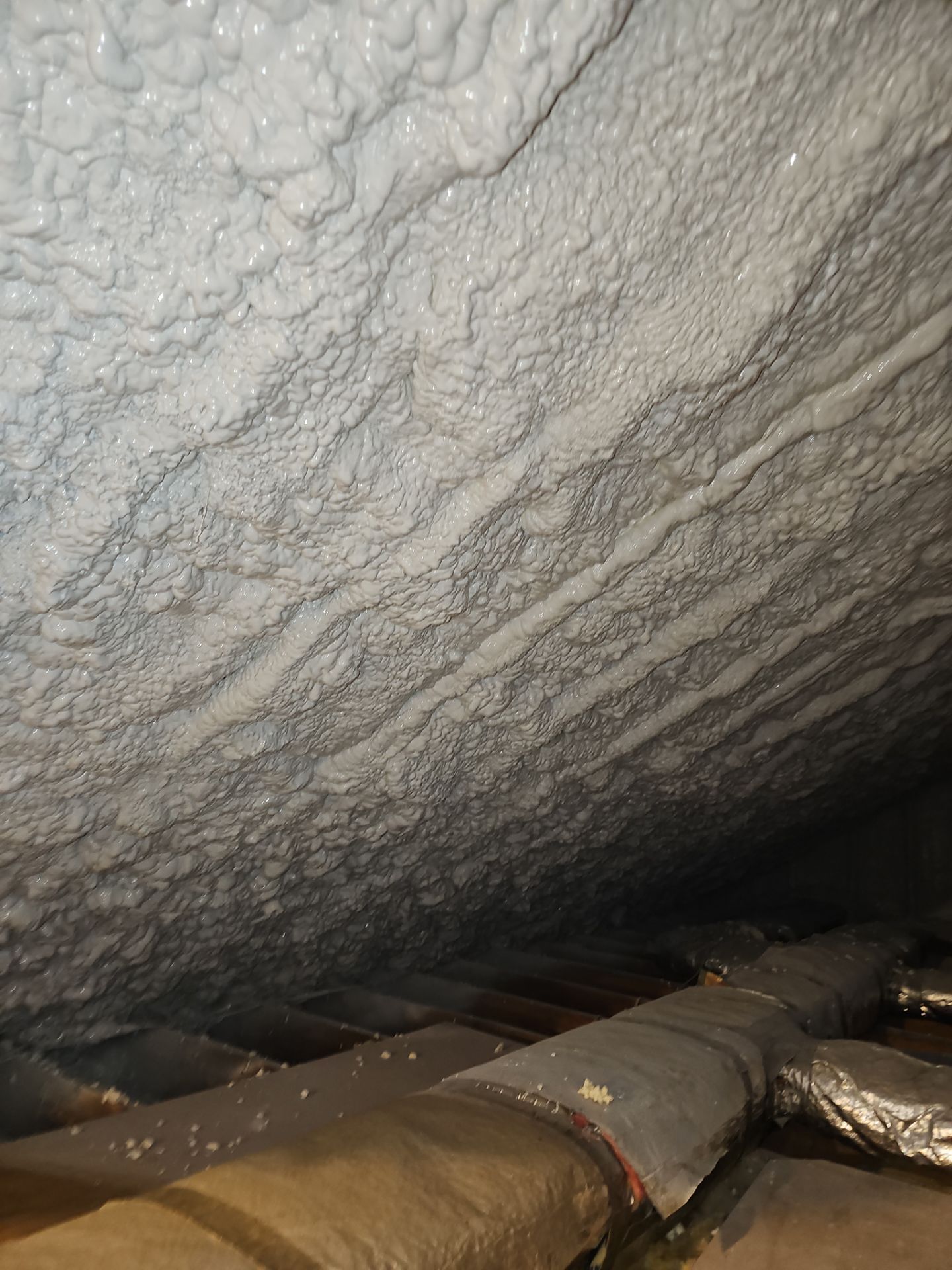 Attic Retrofit using open cell spray foam by NYS Foam & Energy