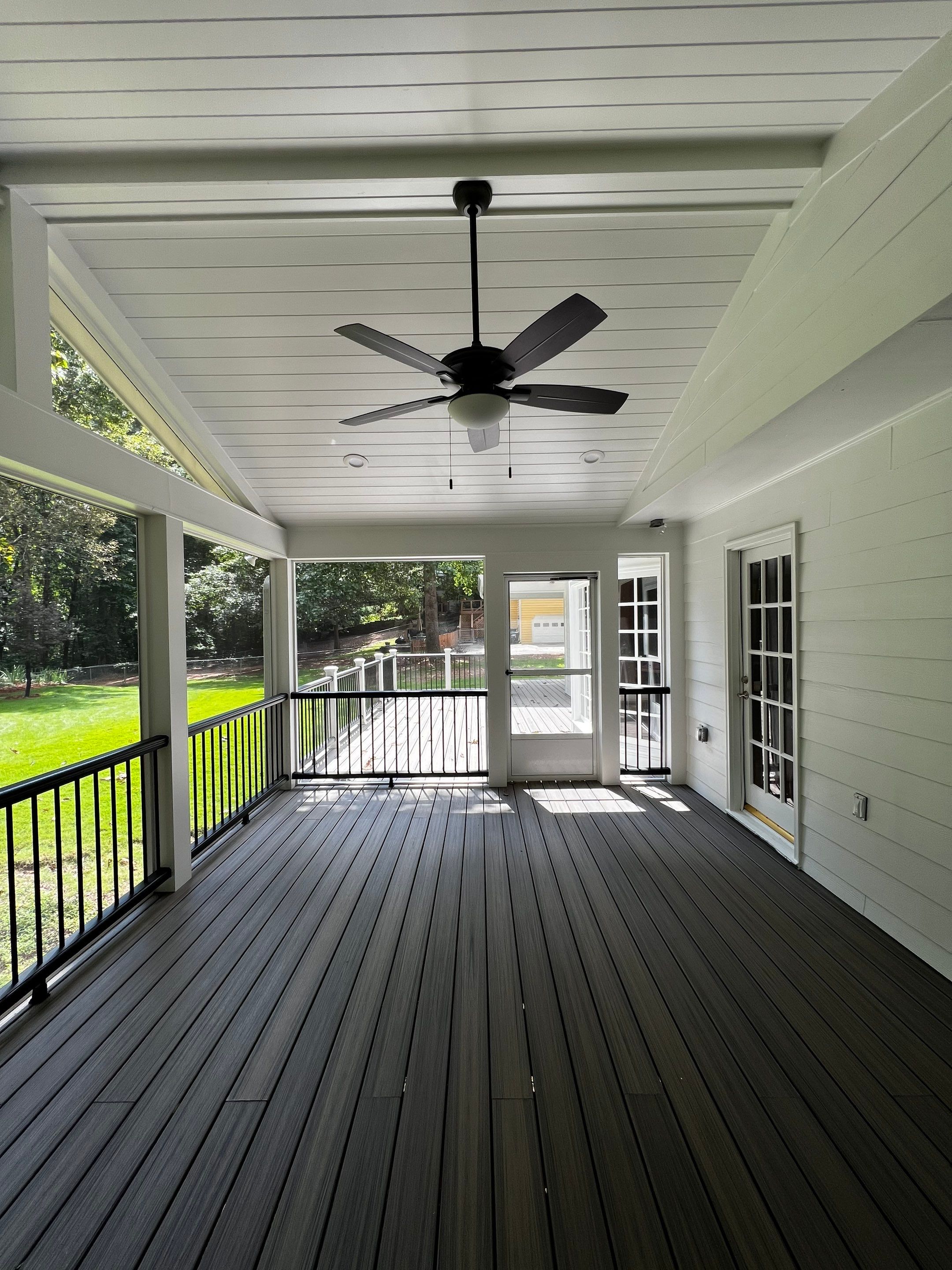 Elevated Composite Deck and Screened Porch Construction in Duluth by Swift Home Renovations 