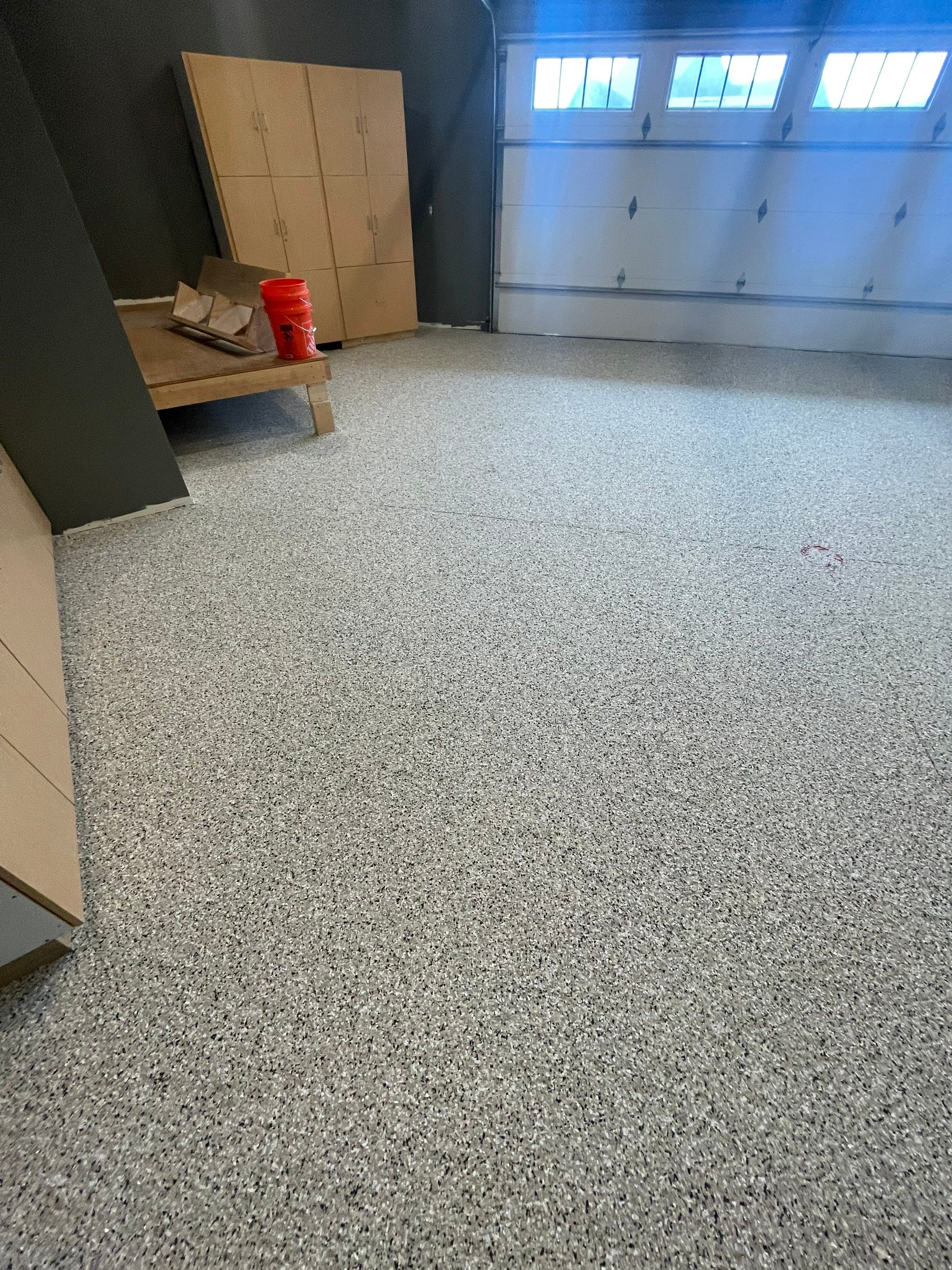 Custom Speckled Concrete Coating for Dell Rapids Garage by Select Painting, Coatings & Garage Cabinets