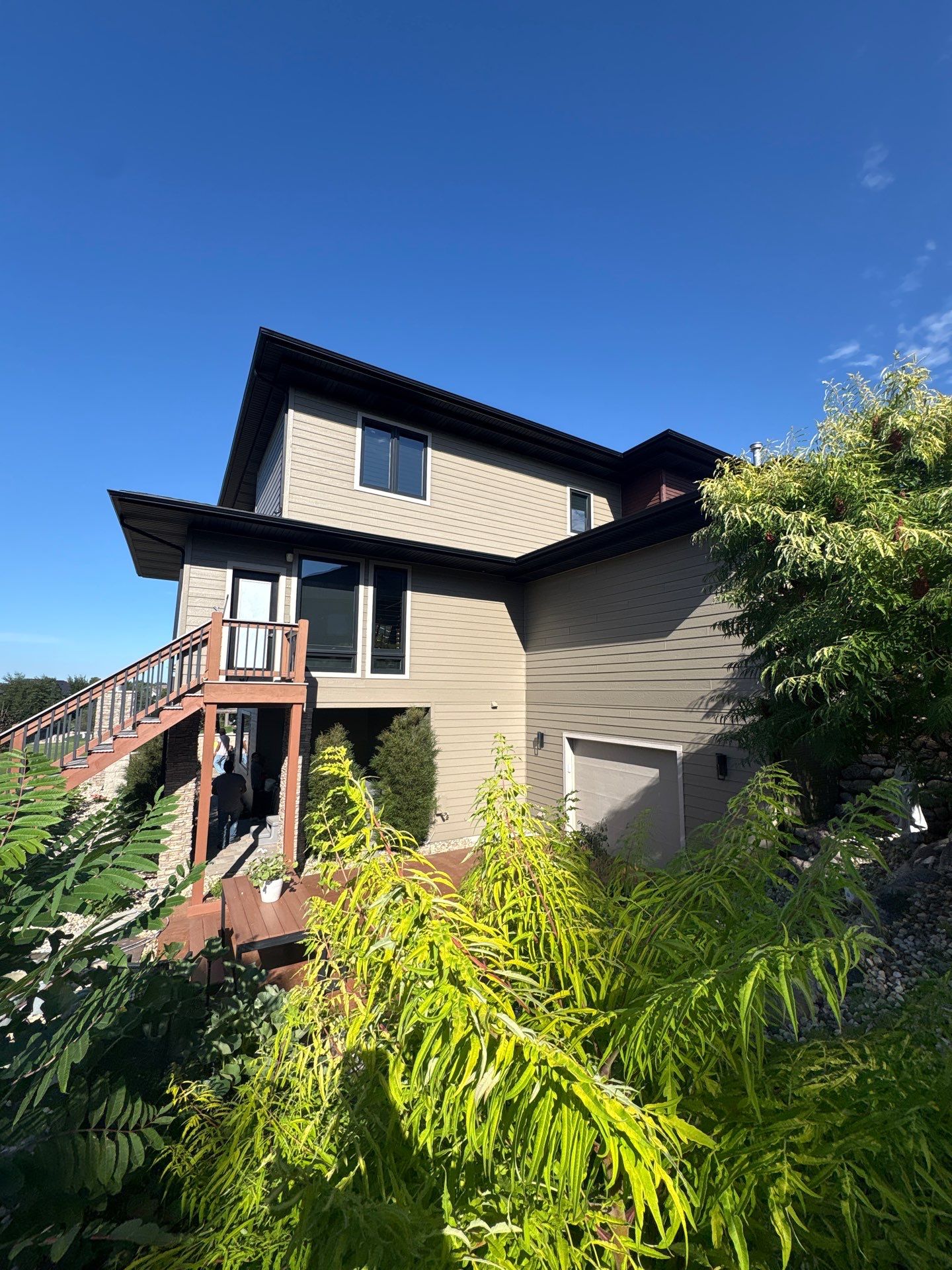 Exterior Painting and Siding Refresh for Multi-Level Tea Residence by Select Painting, Coatings & Garage Cabinets