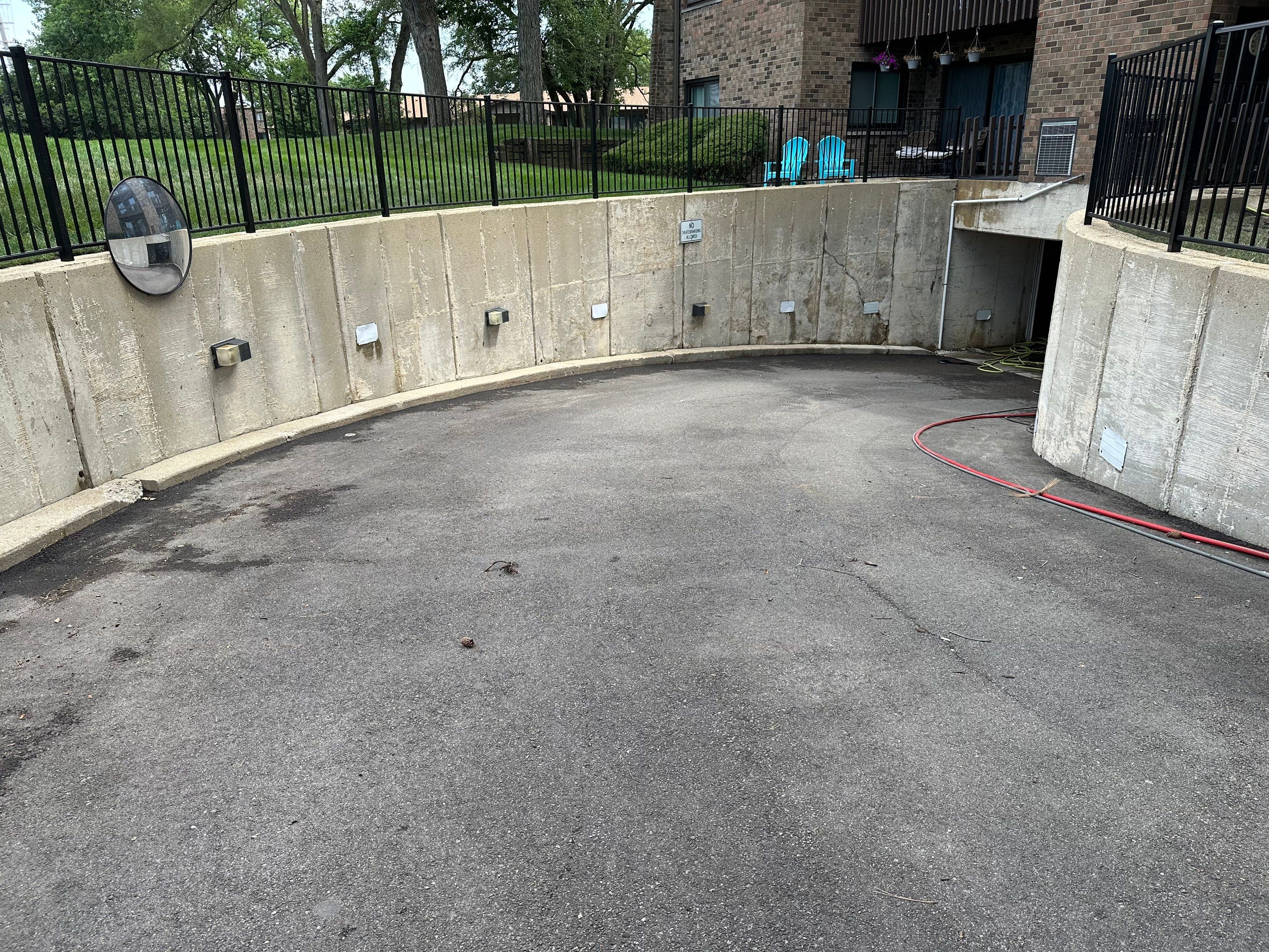 Parking garage using Hot water by Northern Power Washing LLC.