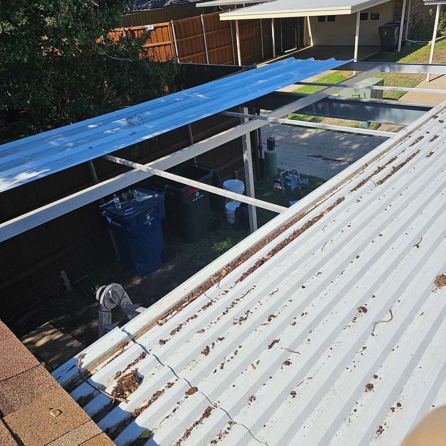 Carport & fence stain by EL-GC LLC 