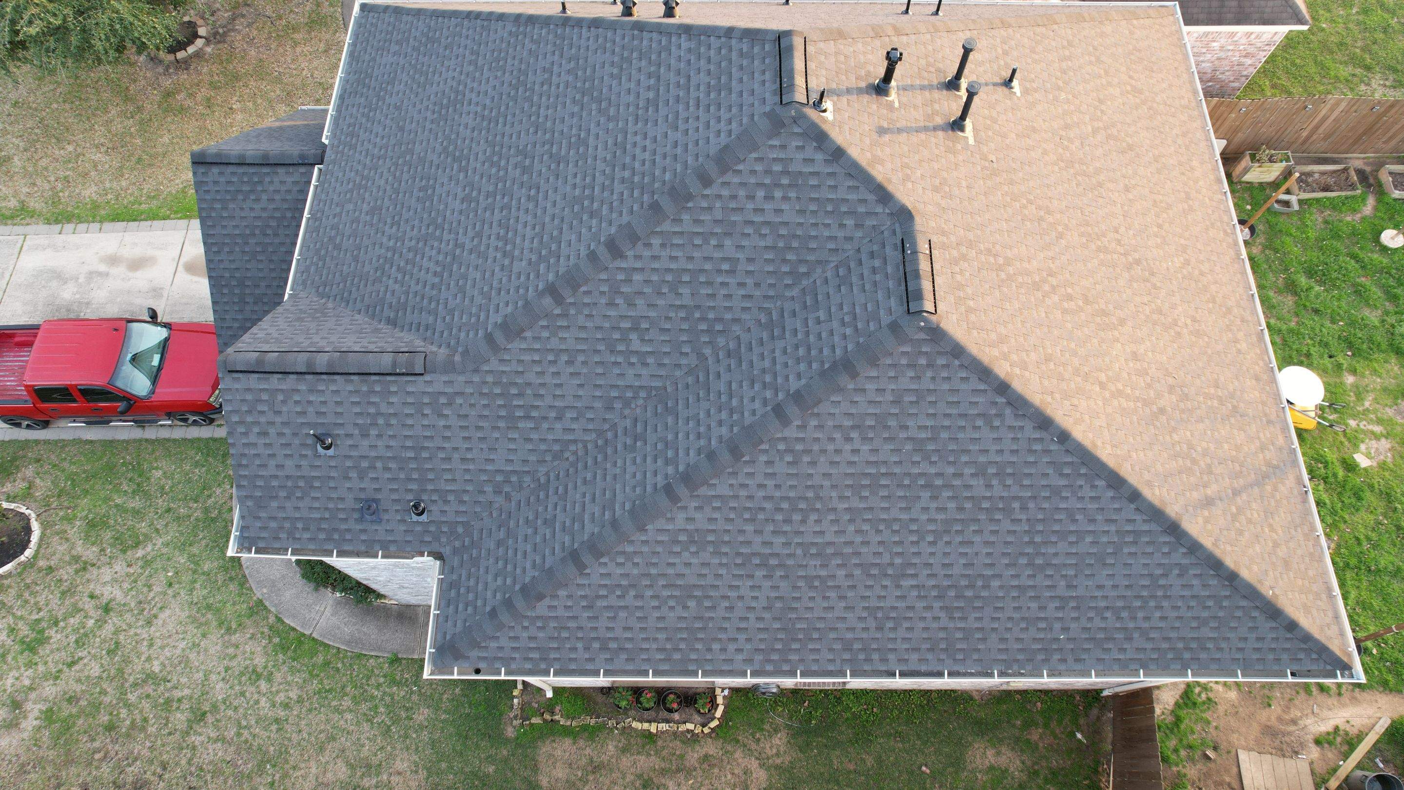 Slate-Gray Roof on Stone-Front Home — Spring, TX by PL Roofing & SB Roofing, LLC.