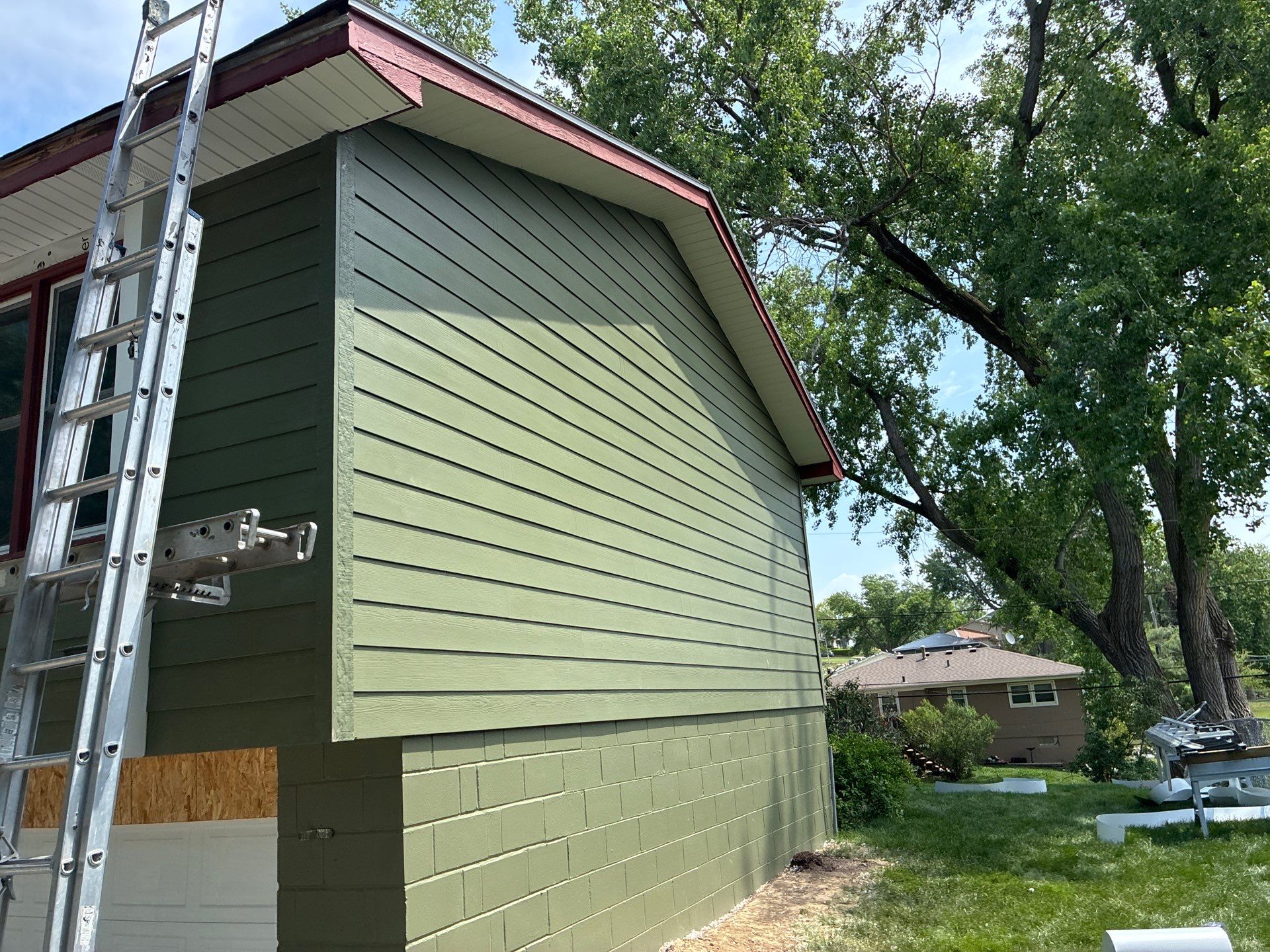 James Hardie Siding Replacement in Omaha with Mountain Sage Finish by Carps Complete Exteriors