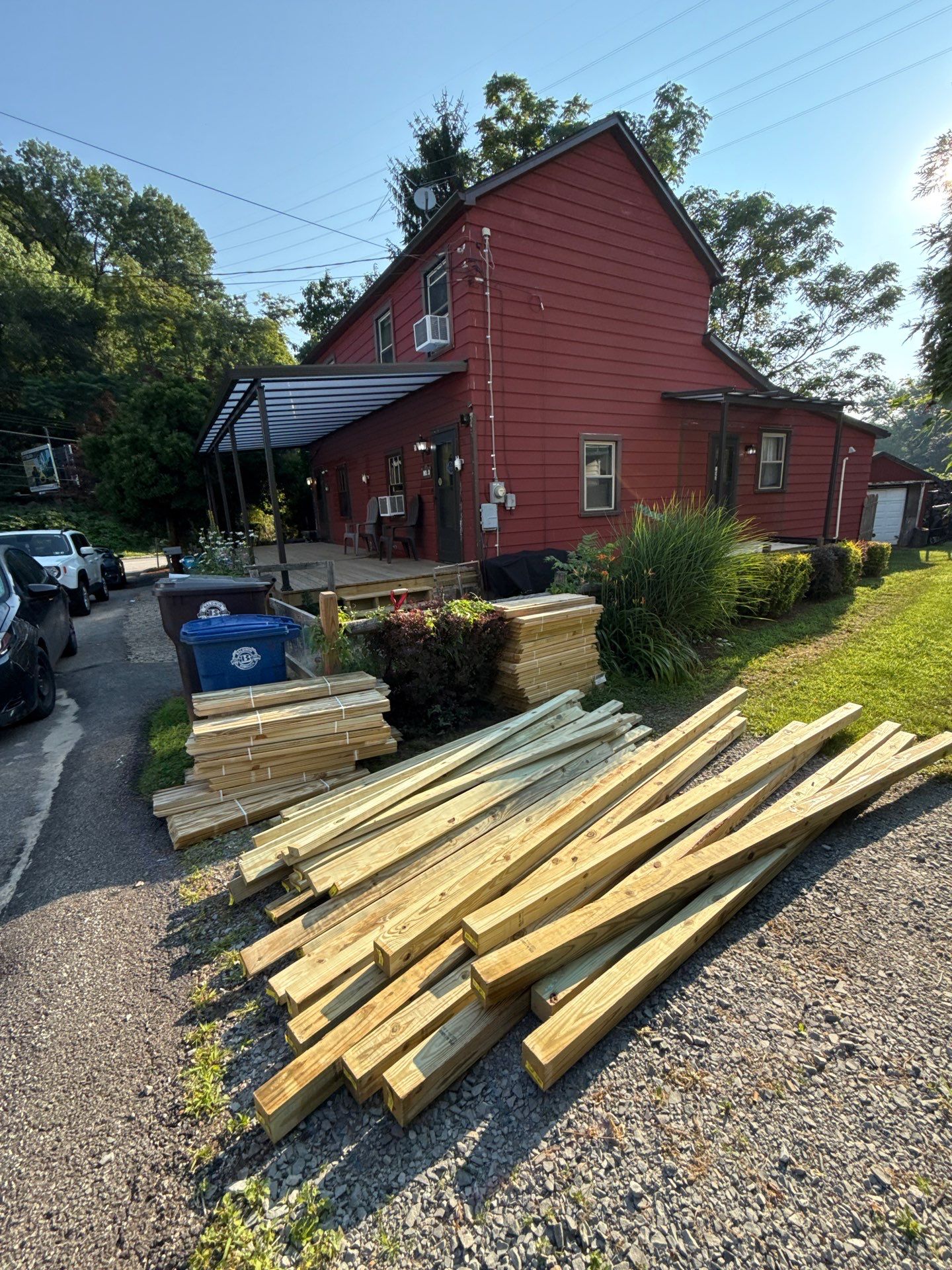 Roof sunspace deck  by Cousins Roofing Siding & Decks