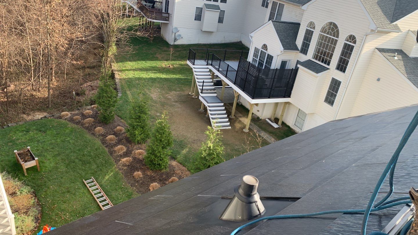 Tesla Solar Roof and Gutter Installation by American Home Contractors