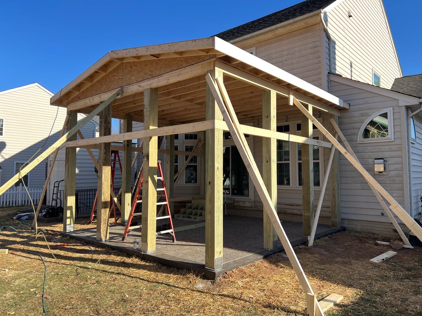 Custom Screened-In Porch with Stamped Concrete Patio in Warrenton by Jakari Restoration & Construction LLC