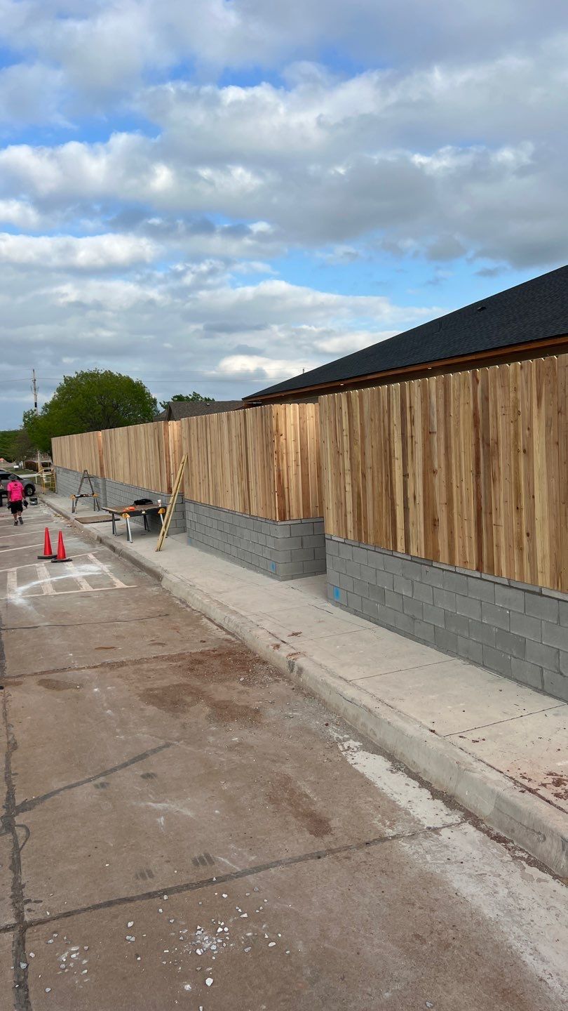 Cedar Fence using Cedar Pickets and Metal Poles by Clays Services Inc