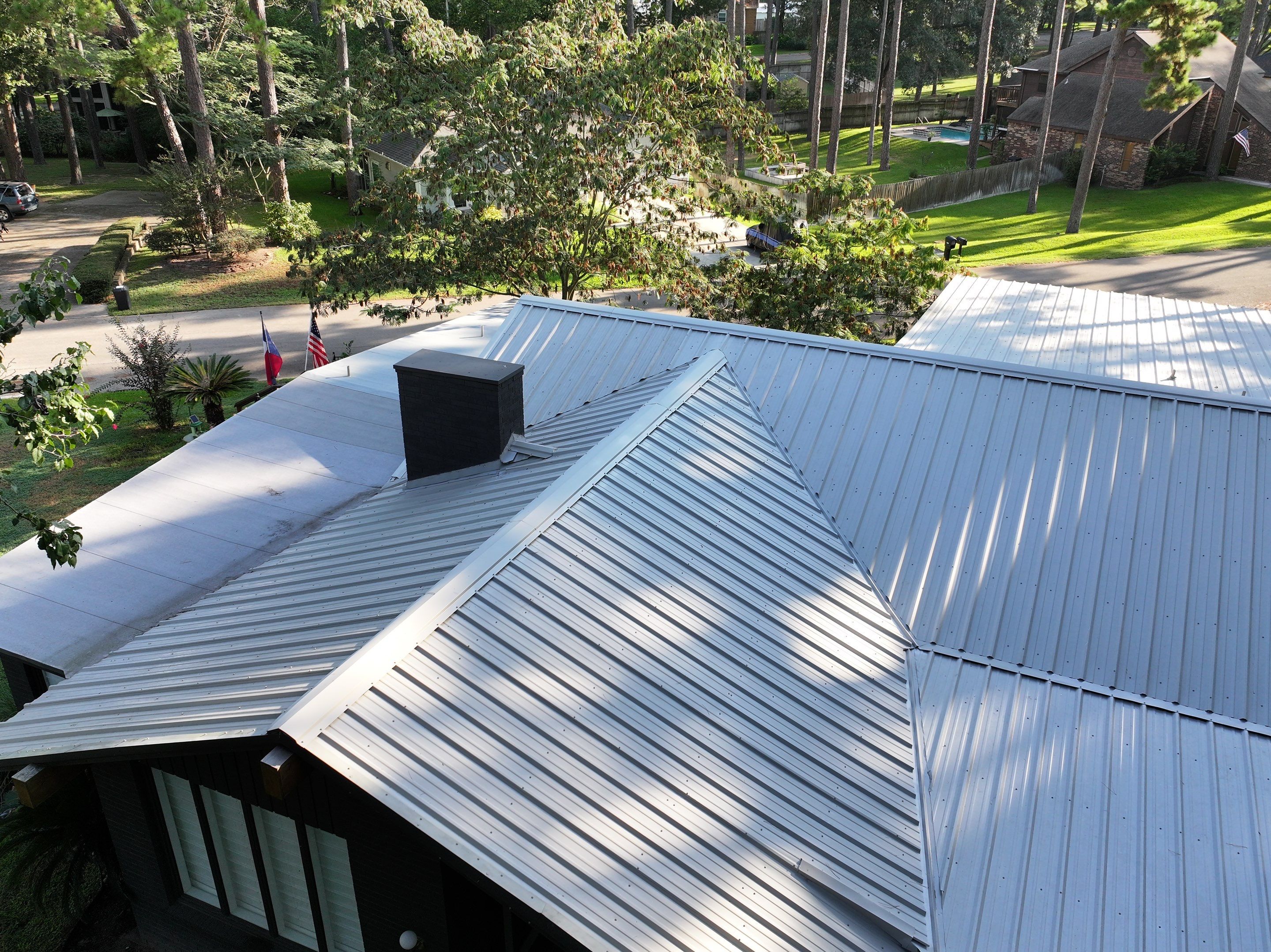 White Standing Seam Metal Roof Replacement in Willis, Texas by Abbott Roofing Company