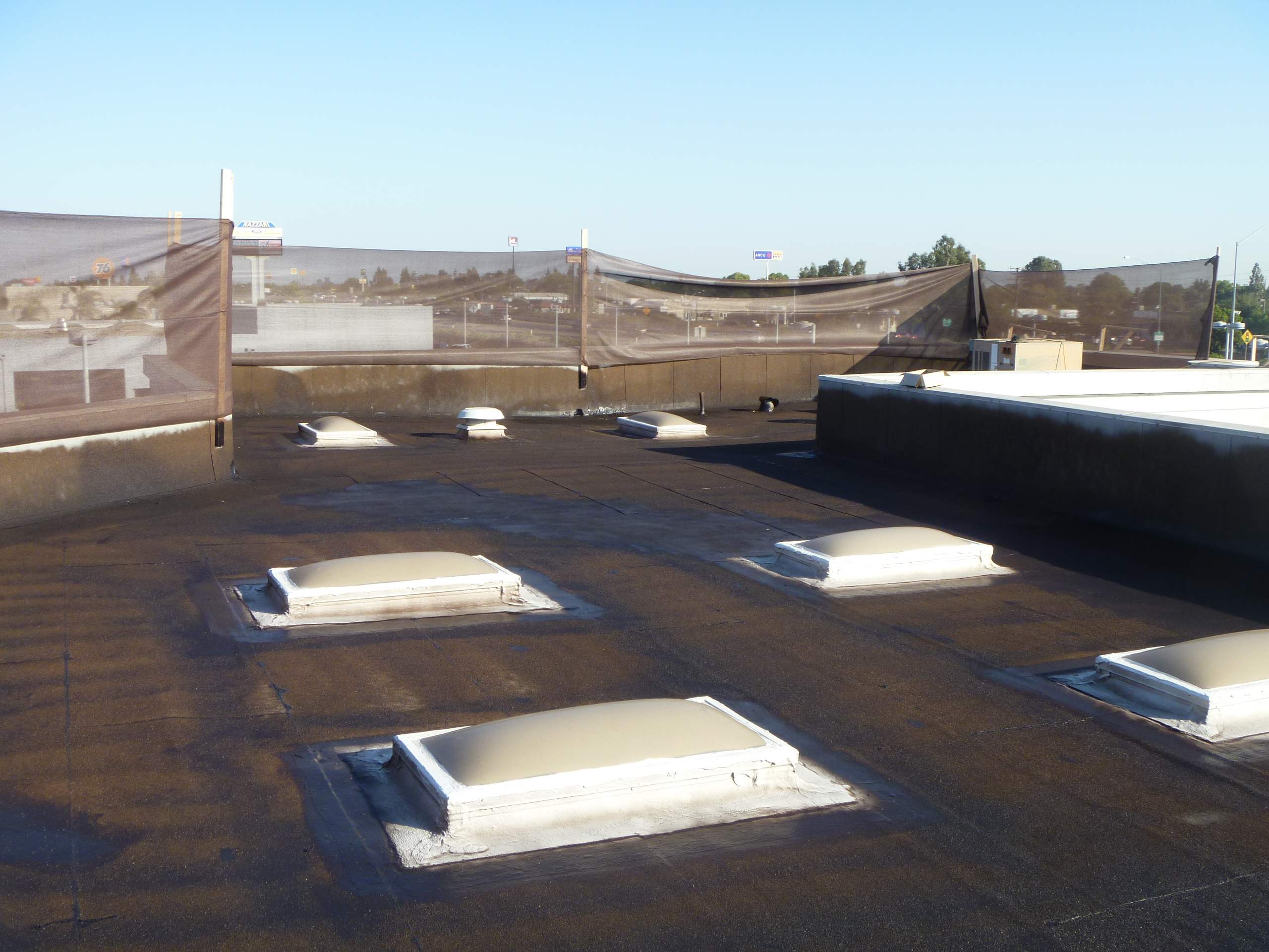 Commercial Roofing Installation using Spray foam and Conklin Benchmark/PUMA XL 18 yr warranty coatings by Straight Edge Roofing Inc