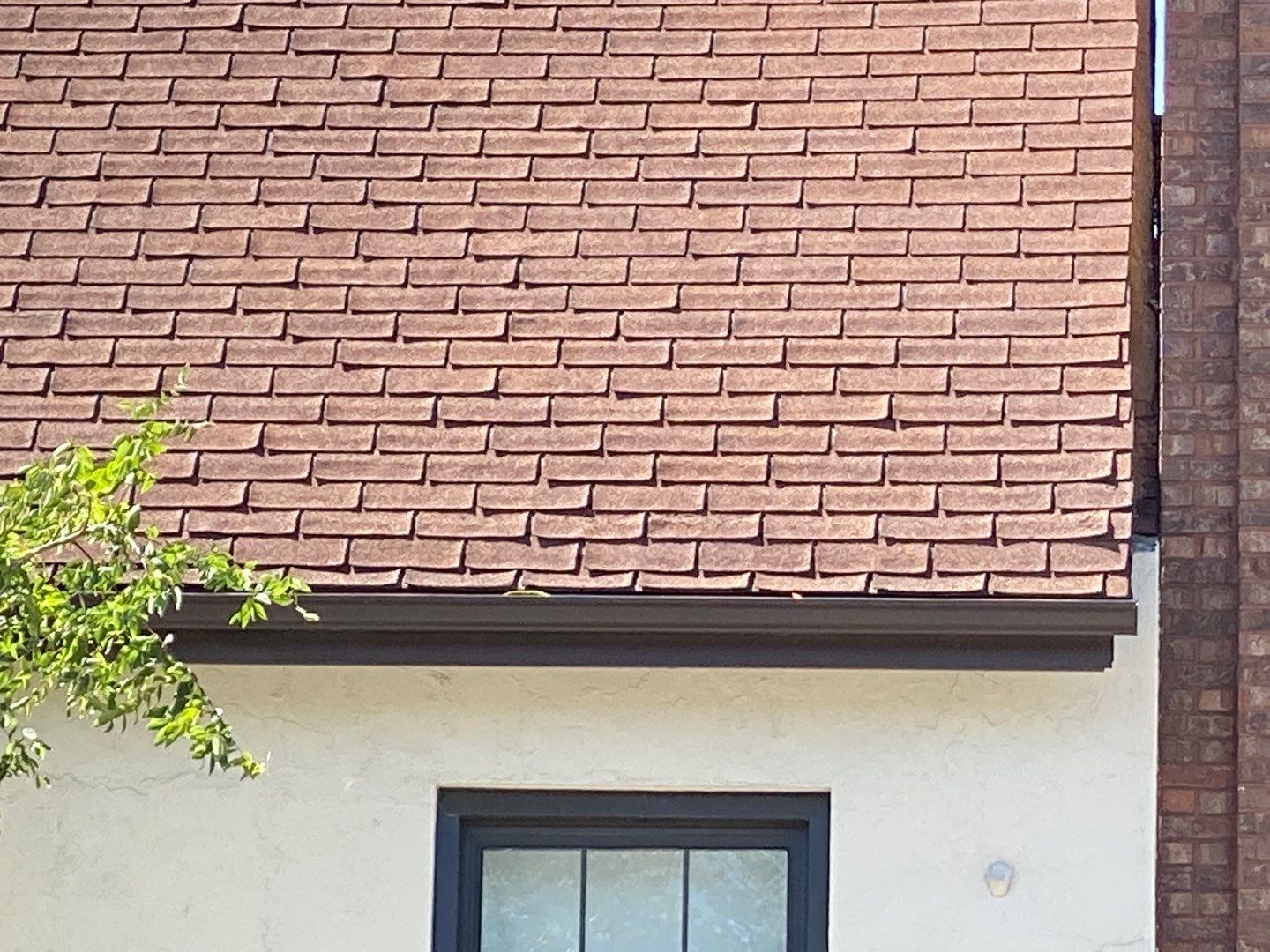 Asphalt Roof Replacement with Aluminum Gutter Installation by Custom Installations