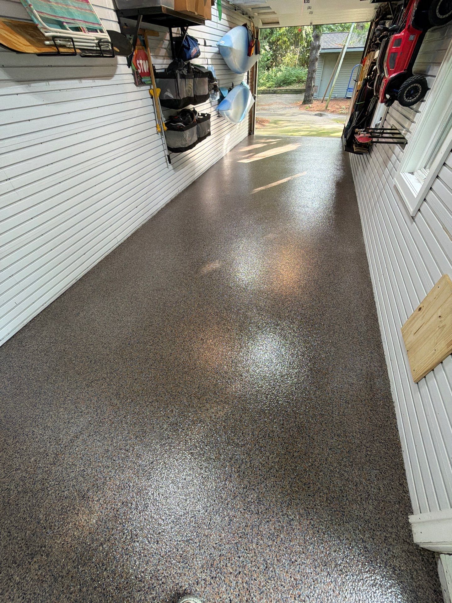 Residential Garage Epoxy Flake Floor Installation in Grand Haven by Gordon Painting
