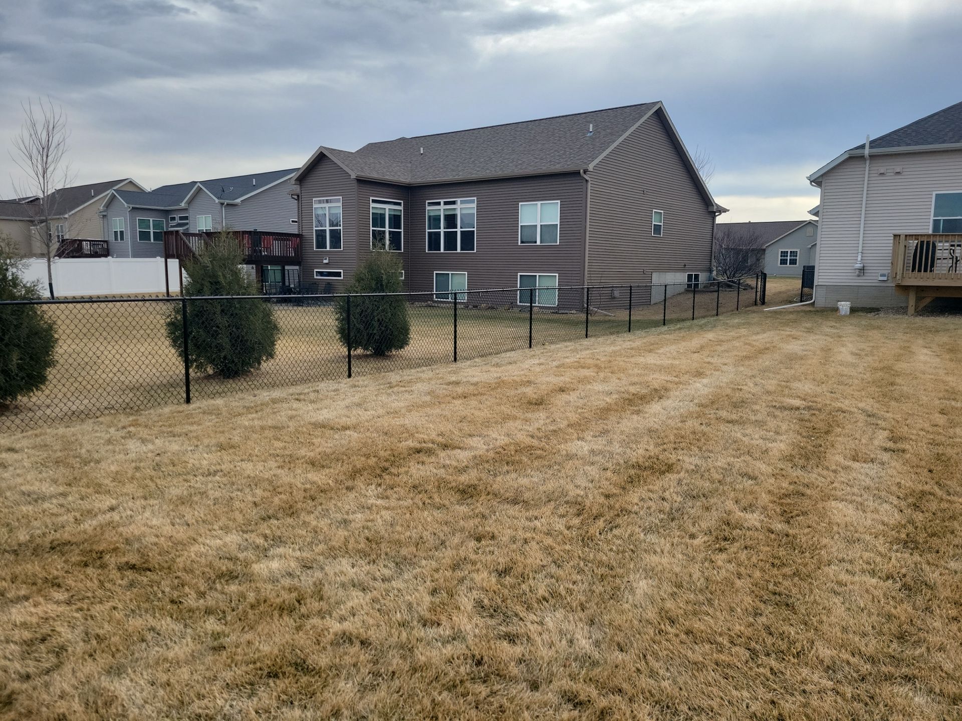 Black Chain Link Fence and Gate Installation in Cedar Falls by Perfect Picket Fence and Stain