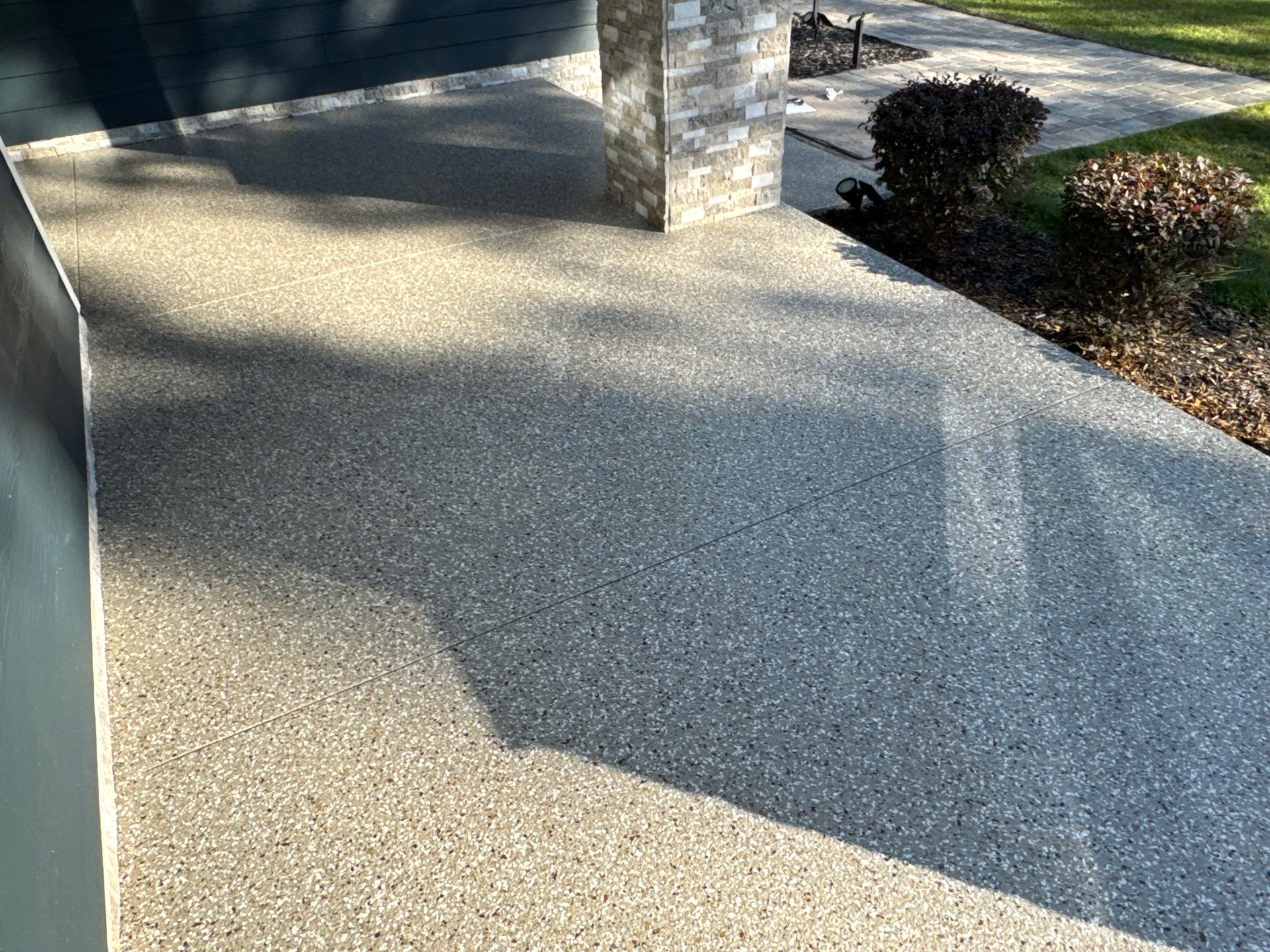 Front and Back Porches in Chiefland, FL in Pebble Beach by Cross Creek Concrete Coatings