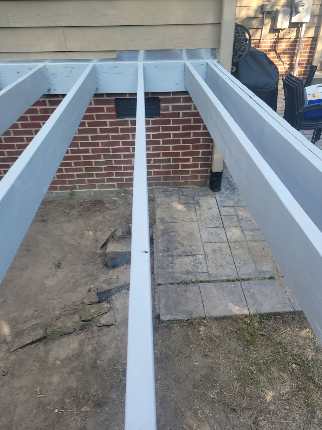 Fuquay-Varina Outdoor Upgrade – Composite Deck & Paved Landing by Elite Remodeling and Design LLC
