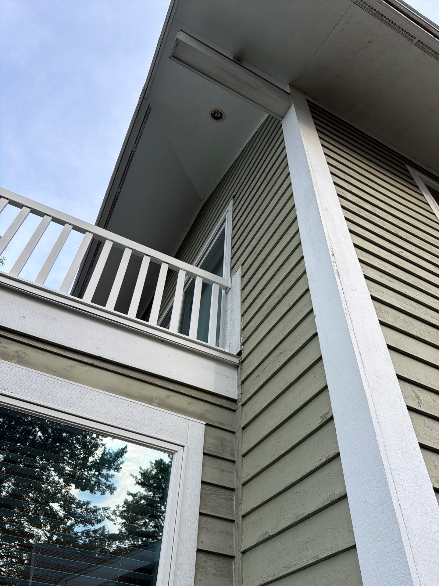 Full Exterior Painting and Trim Restoration for Muskegon Residence by Gordon Painting