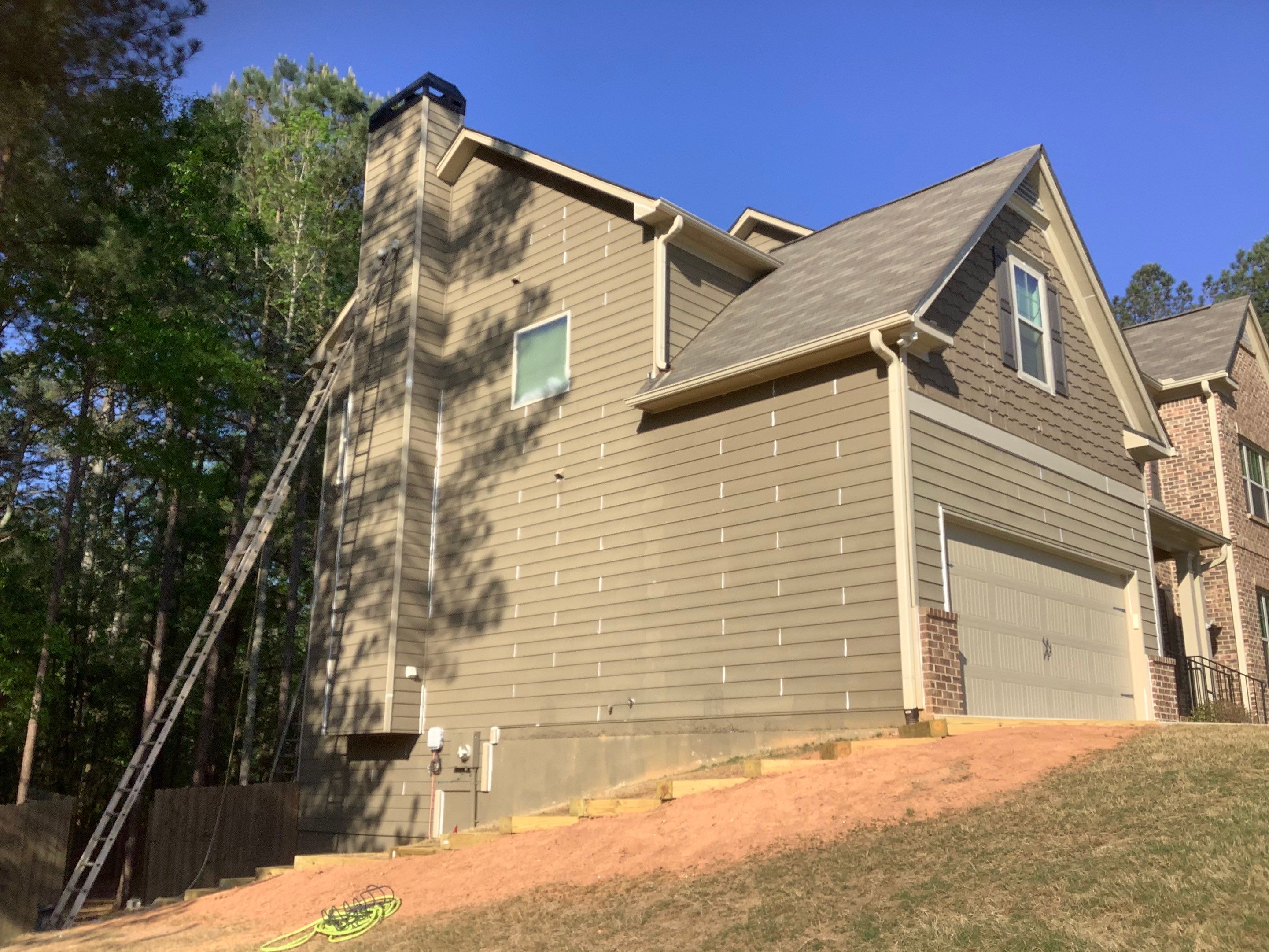 Multi-Surface Exterior Painting for Two-Story Residence in Powder Springs by Swift Home Renovations