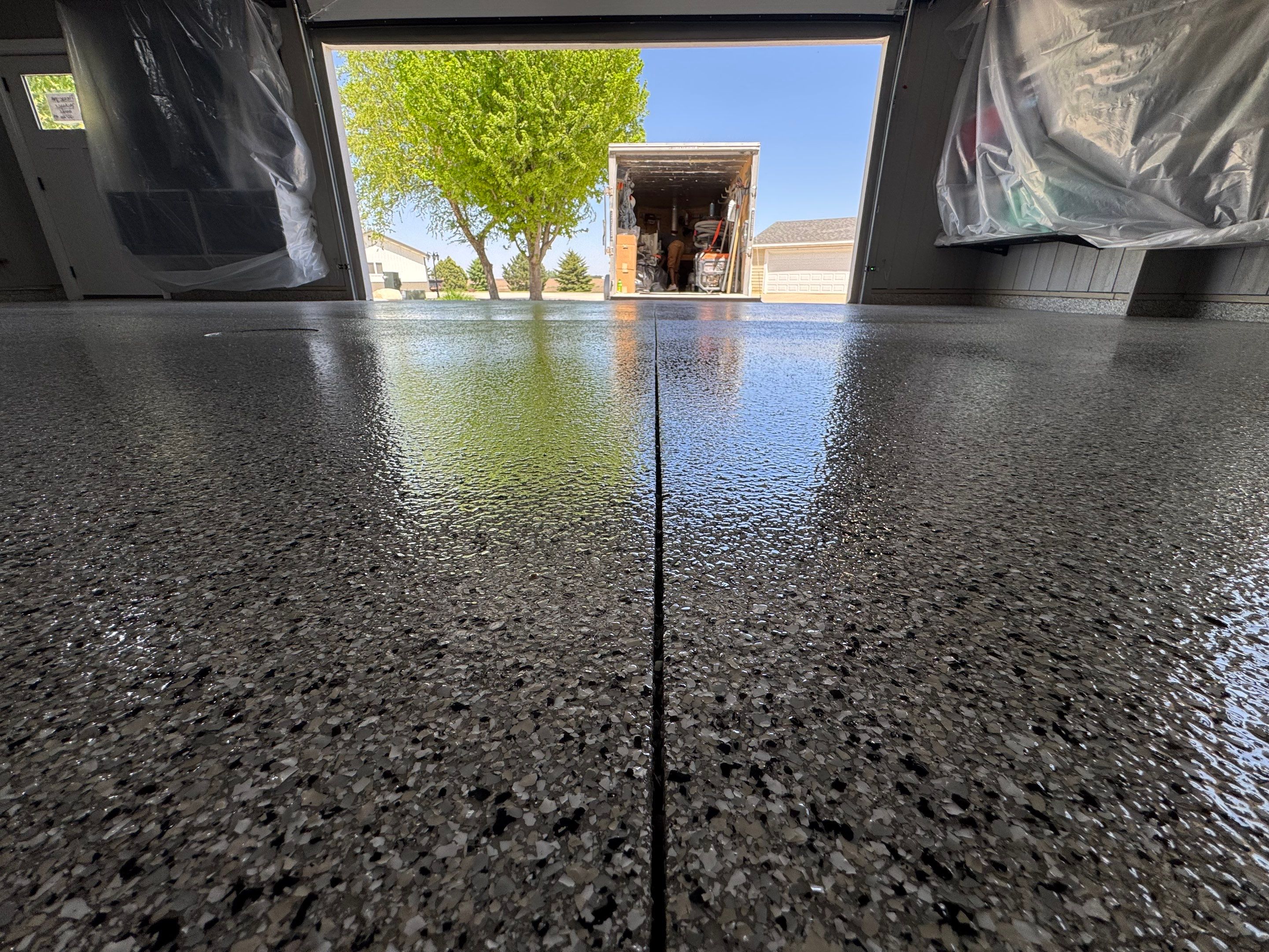 High-Gloss Grey Epoxy Floor Coating for Inwood Garage by Select Painting, Coatings & Garage Cabinets